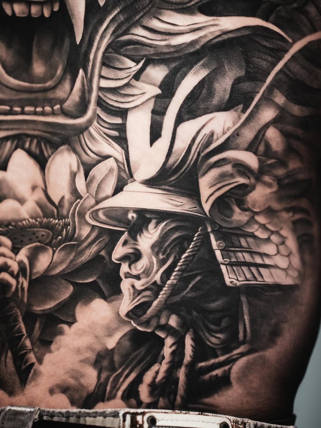 Samurai mask and dragon Japanese tattoo on the torso by Claude Steven Estrada, Las Vegas, Nevada