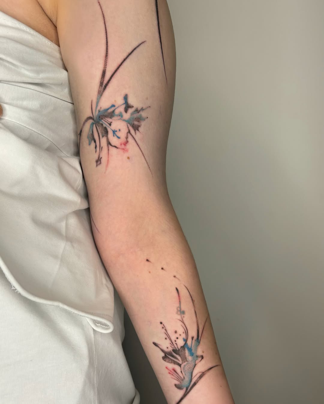 Watercolor flowers watercolor tattoo on the forearm by @havefun_tattoo