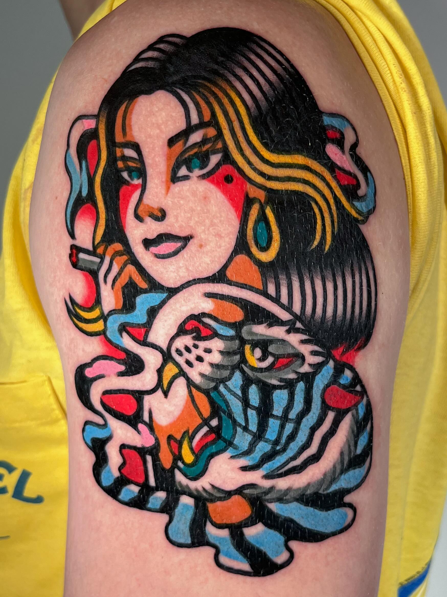 Woman with snake American traditional tattoo on the shoulder by Oldschool Tattooer Takii 타키