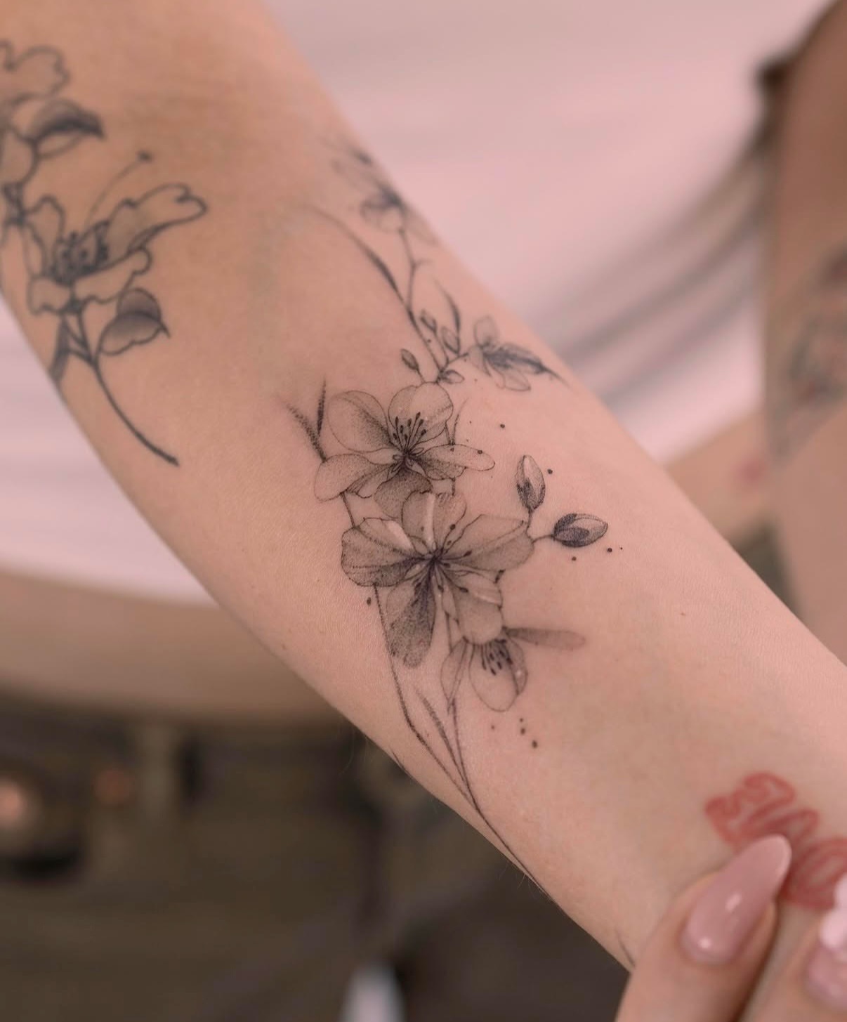 Flowers dotwork tattoo on the forearm by Tattooist hea