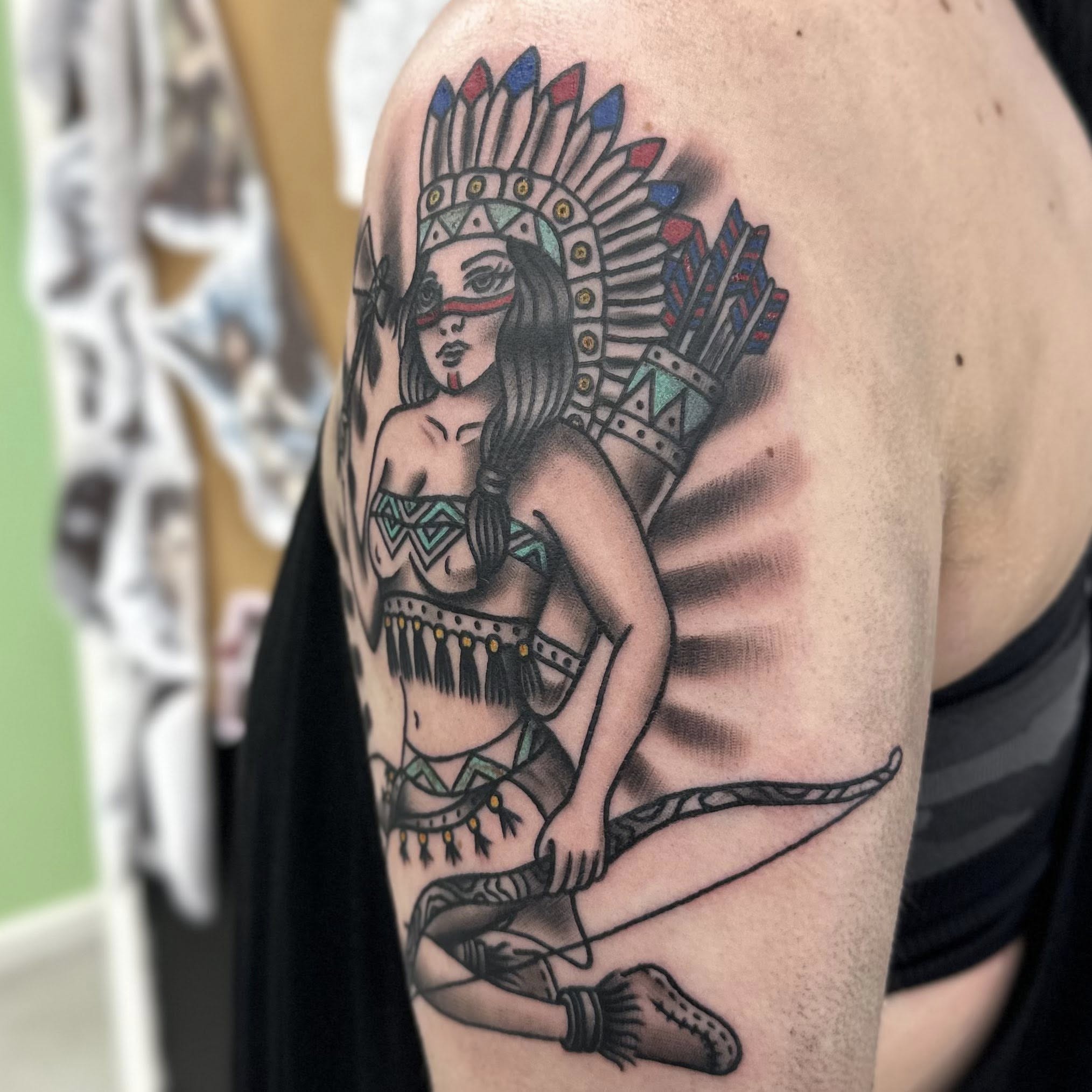 Indian woman American traditional tattoo on the shoulder by Jon Anderson