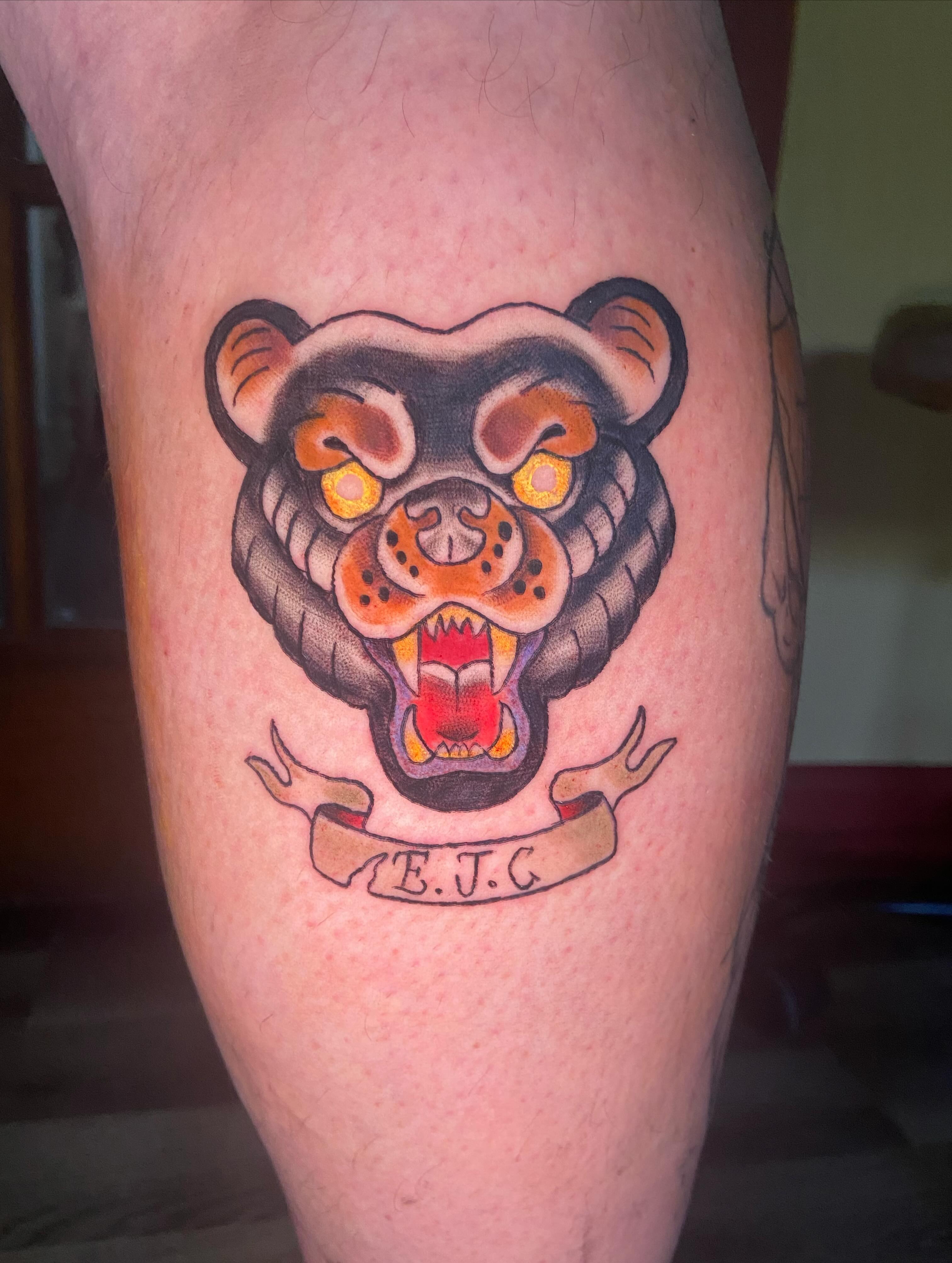 Roaring bear American traditional tattoo on the thigh by 🐆Cam Feral Tattoos