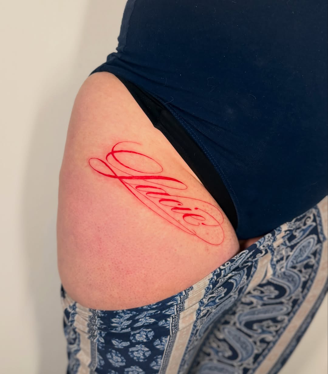 Script lettering lettering script tattoo on the thigh by Orca