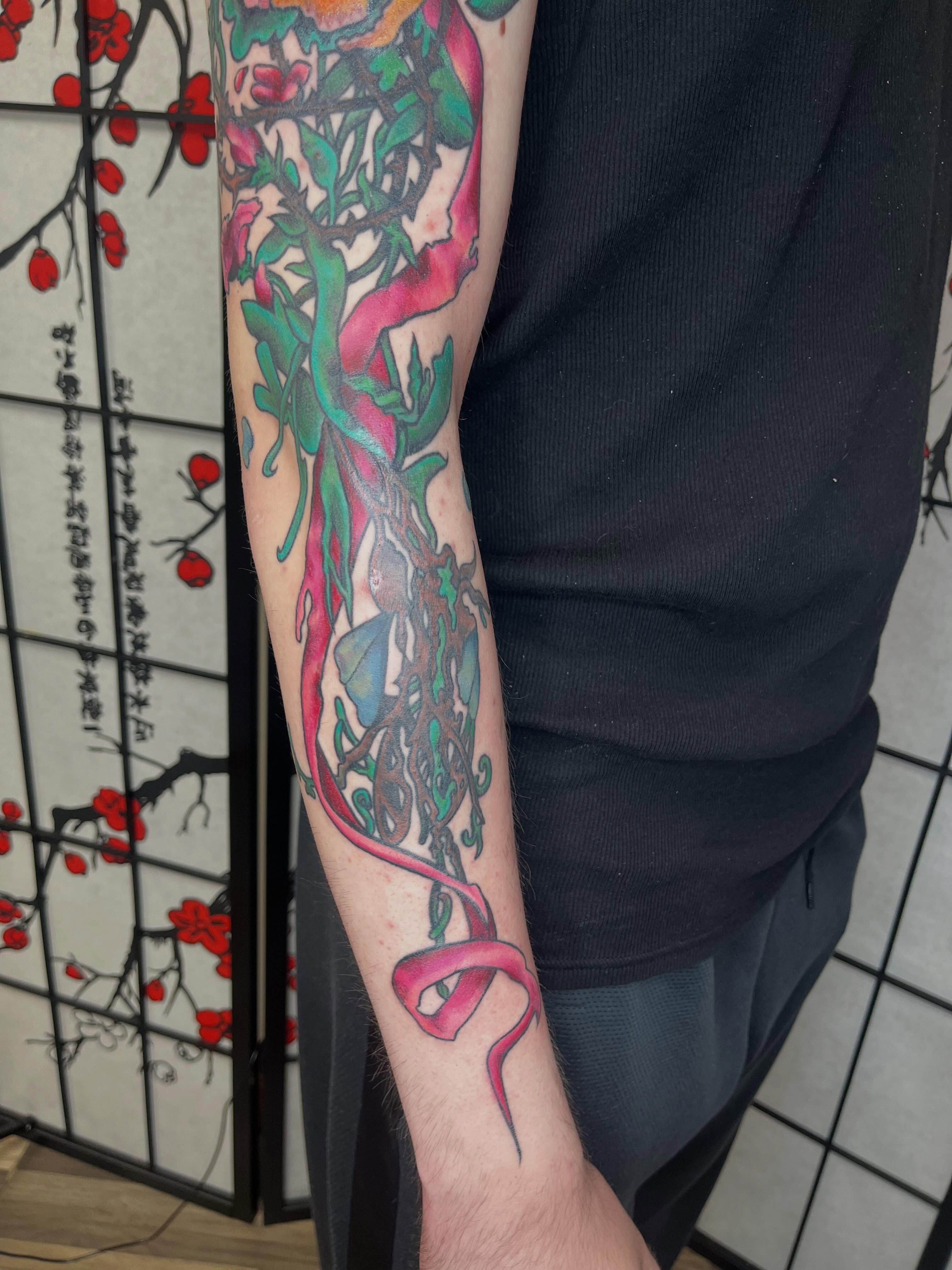 Snake and peony japanese irezumi tattoo on the forearm by Lauryn Dunkle