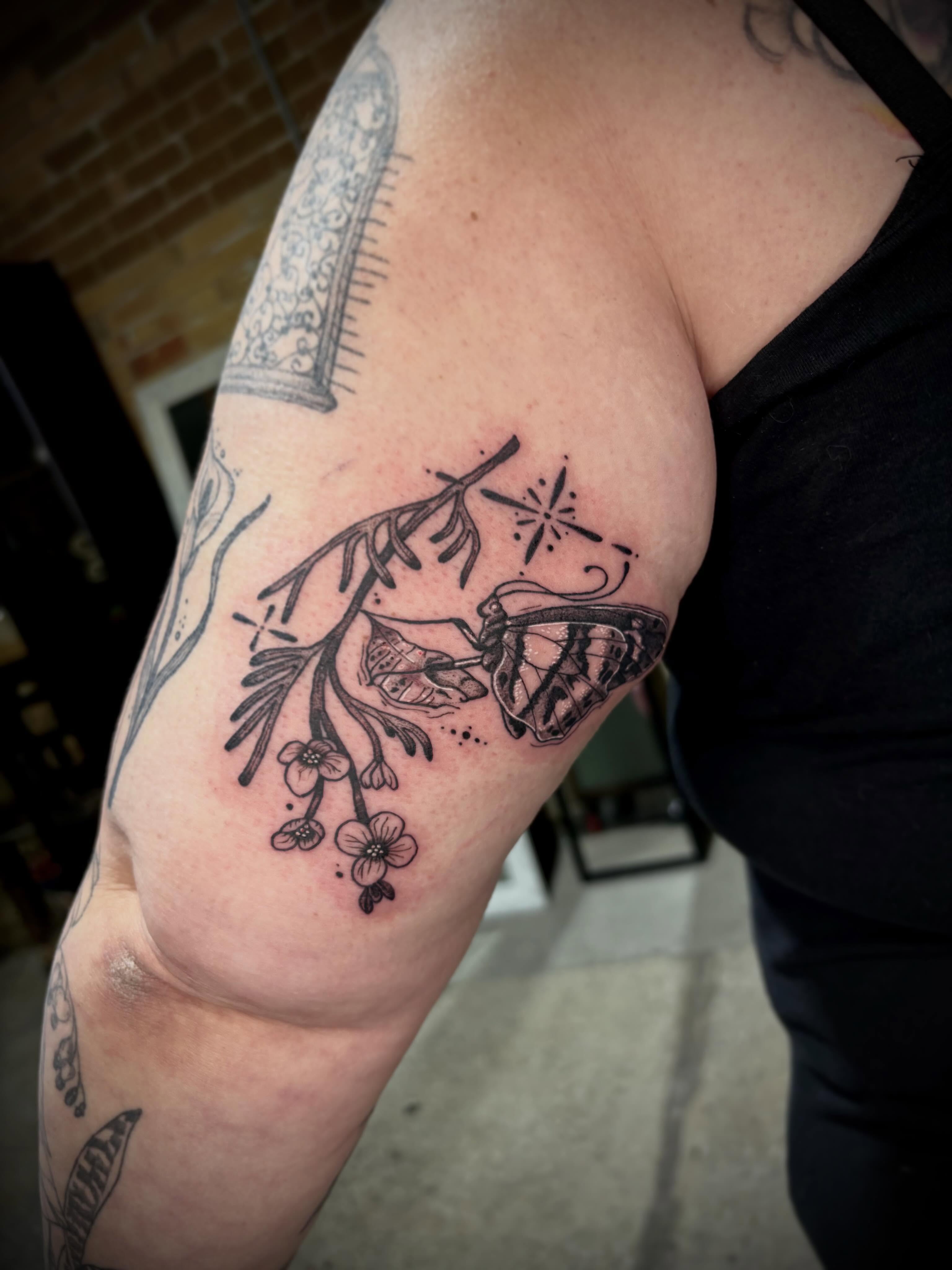 Butterfly and flowers black and grey tattoo on the forearm by destiney rose