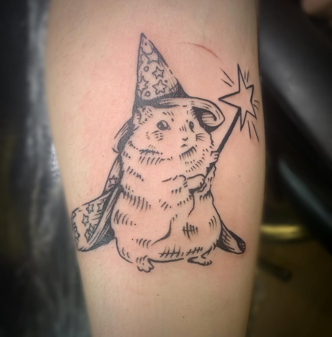 Hamster wizard with magic wand minimalist tattoo on the forearm by Ava Glory Tattoos