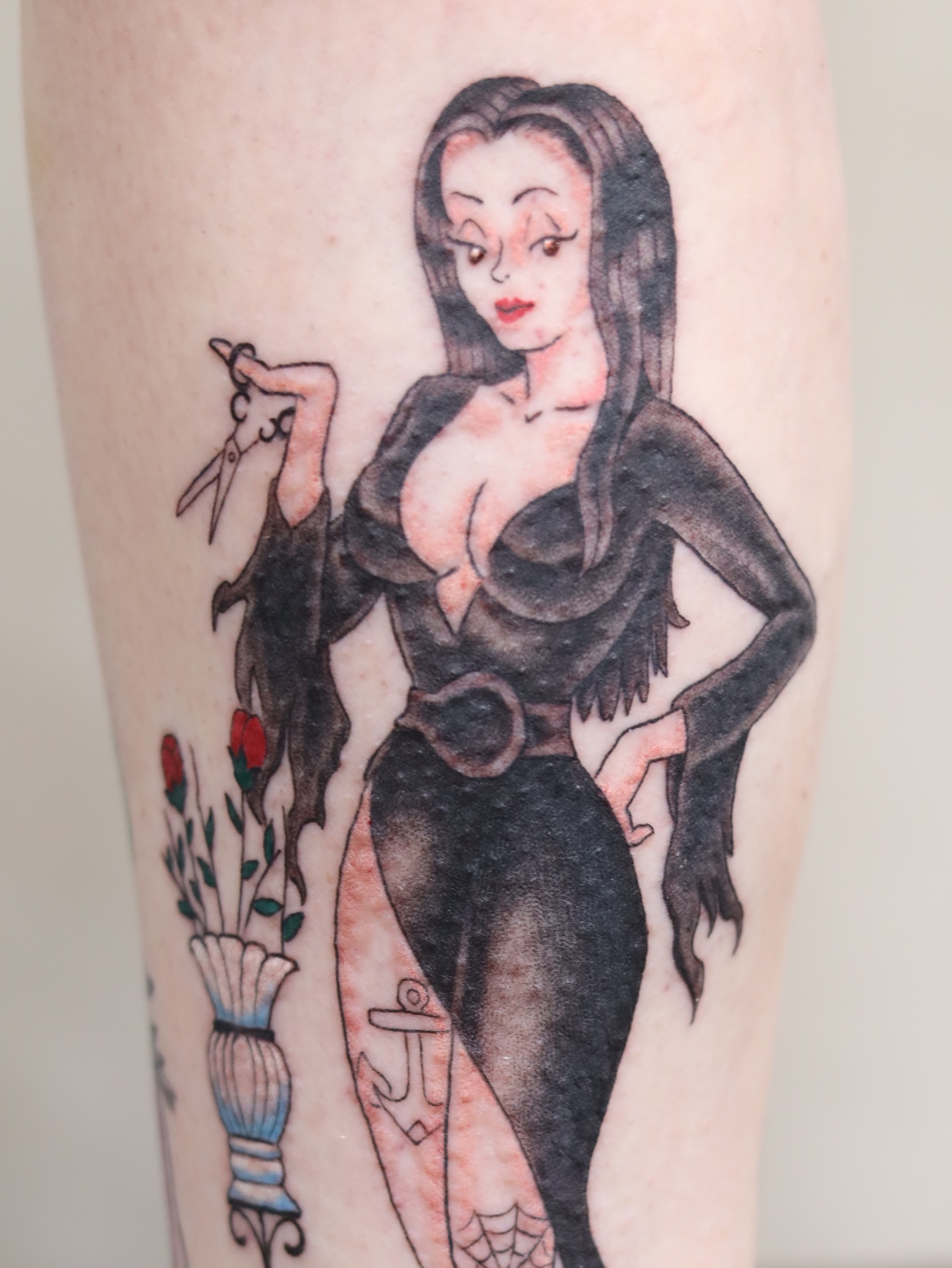 Woman with scissors American traditional tattoo on the leg by Caleb Ortiz