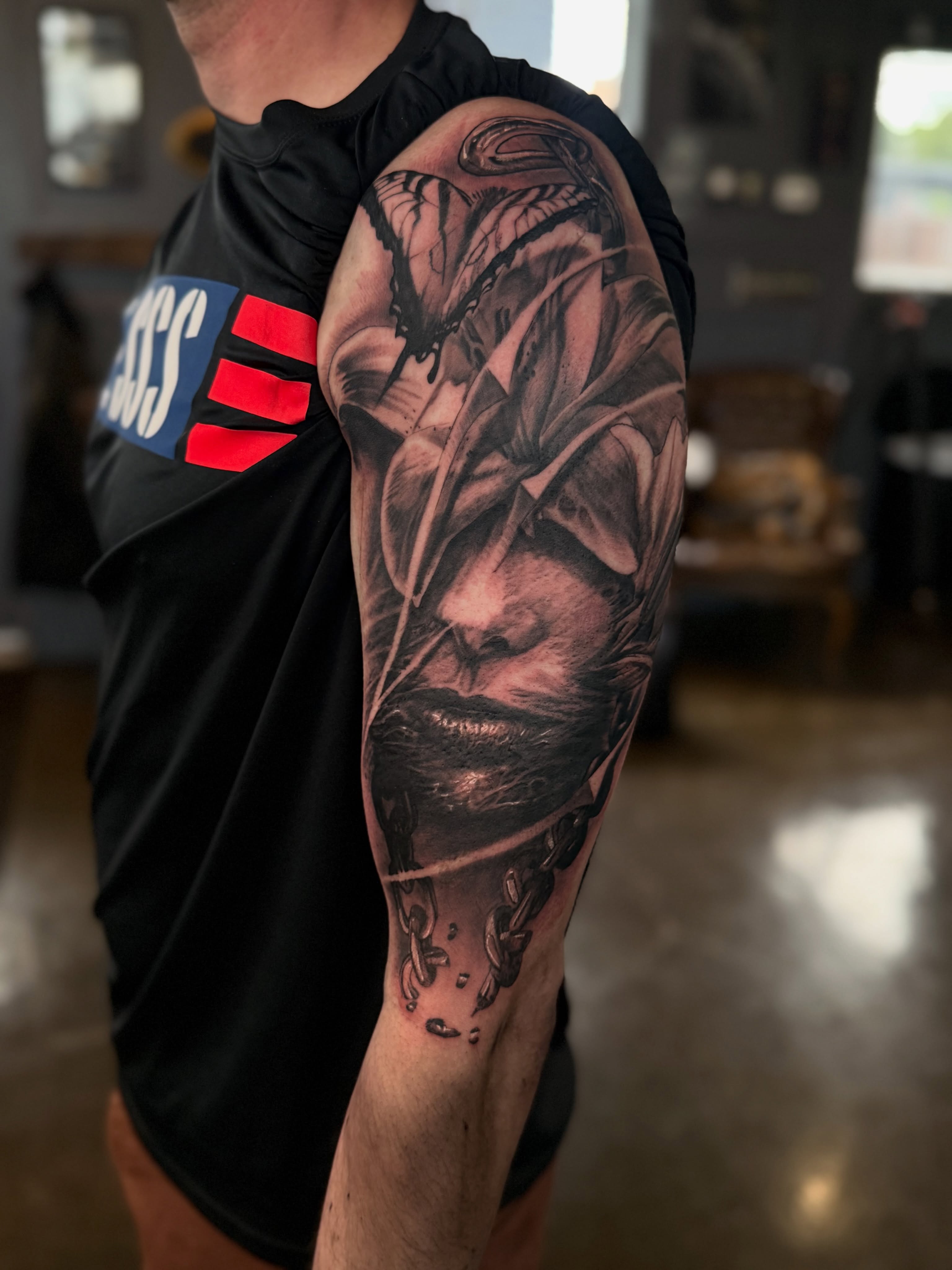 Face with butterfly realism tattoo on the forearm by Miles Haysmith