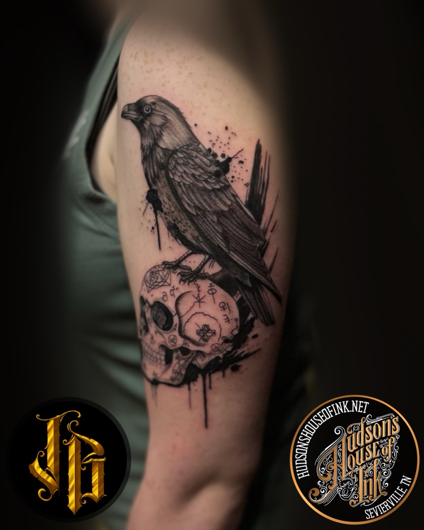 Crow and skull realism tattoo on the forearm by James Brooks