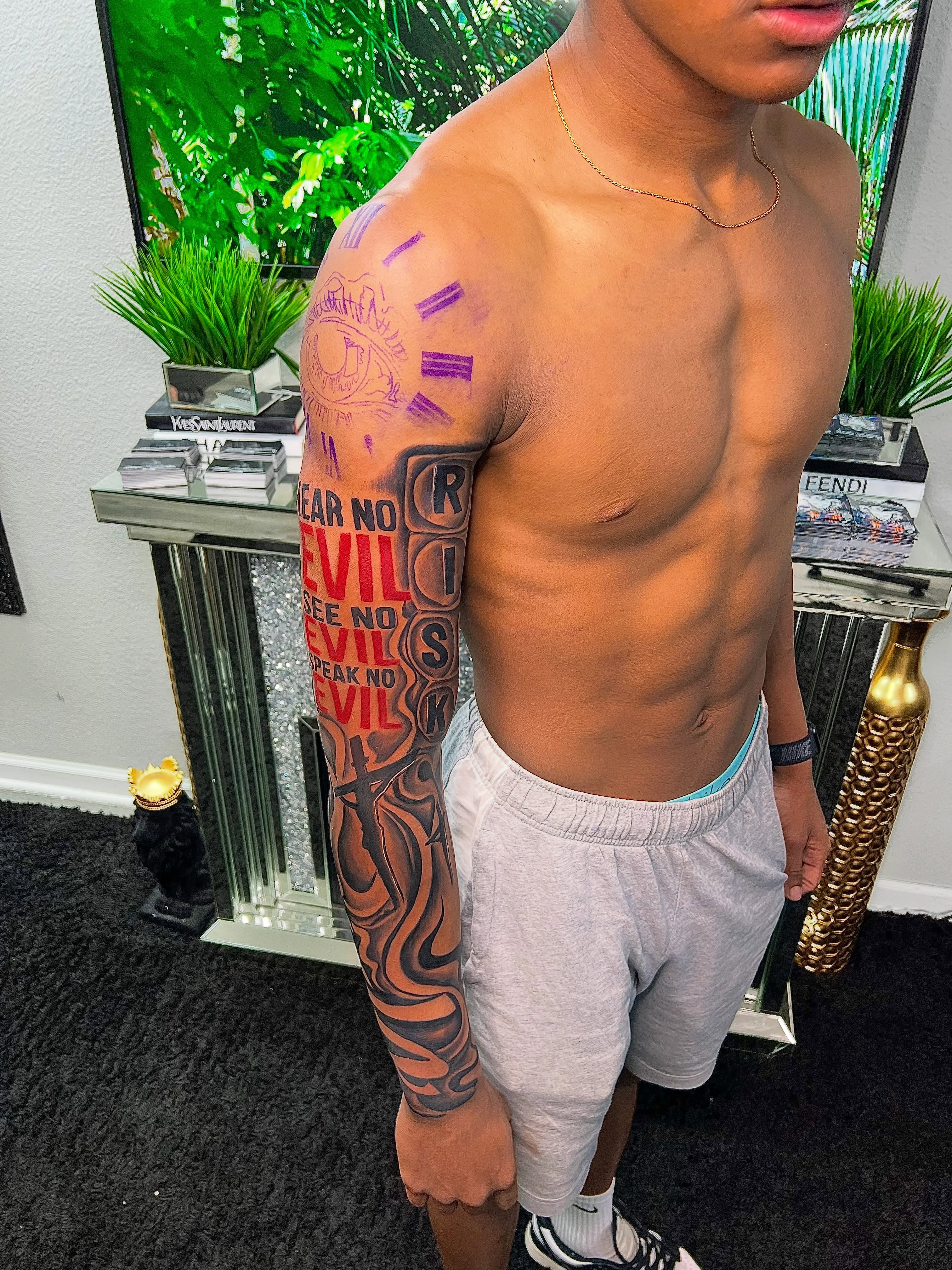 Three wise monkeys American traditional tattoo on the upper arm by Deonte Dwayne Durham