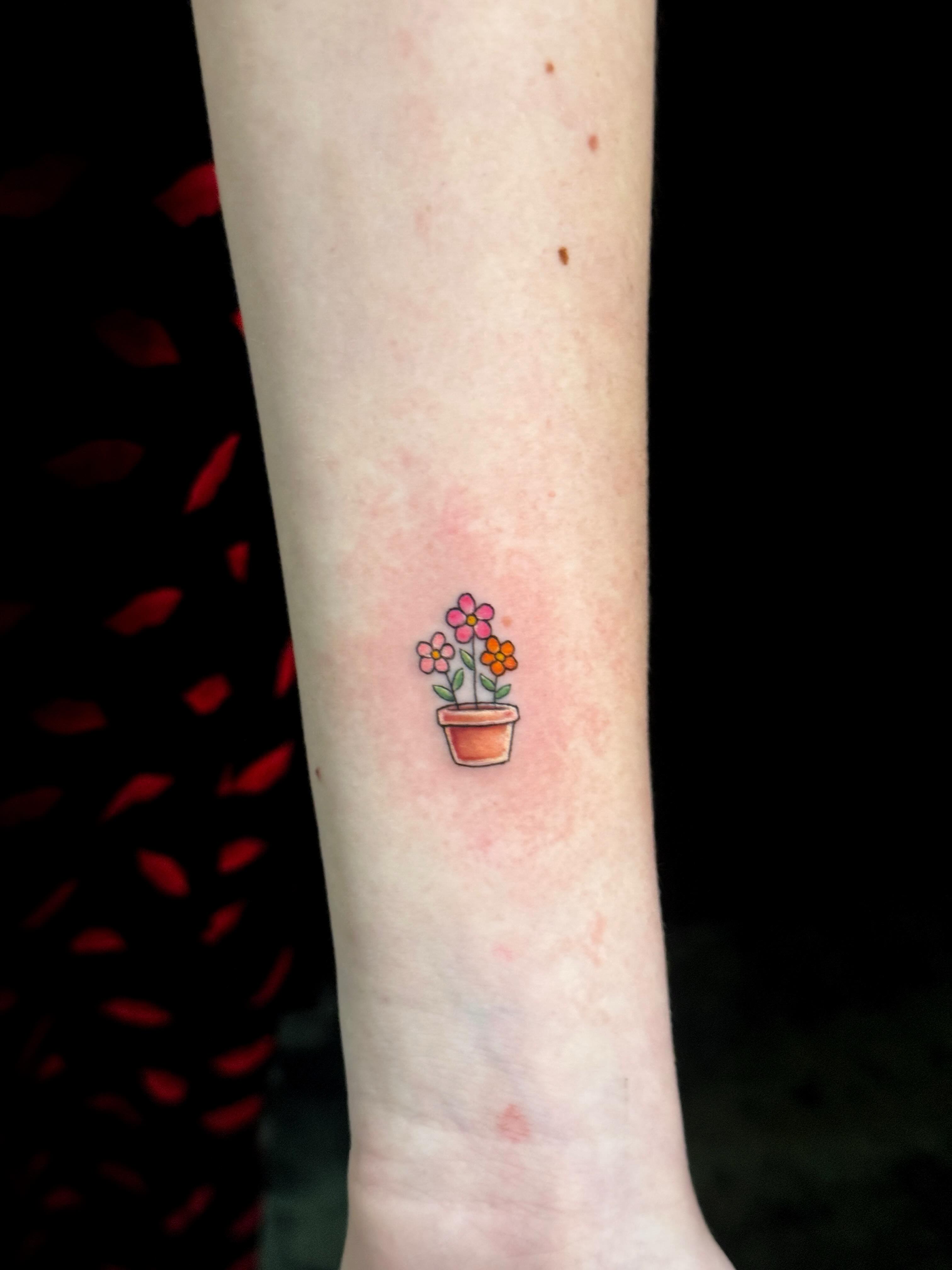 Flower pot watercolor tattoo on the forearm by Violet Michelle Williams, Charlotte, North Carolina