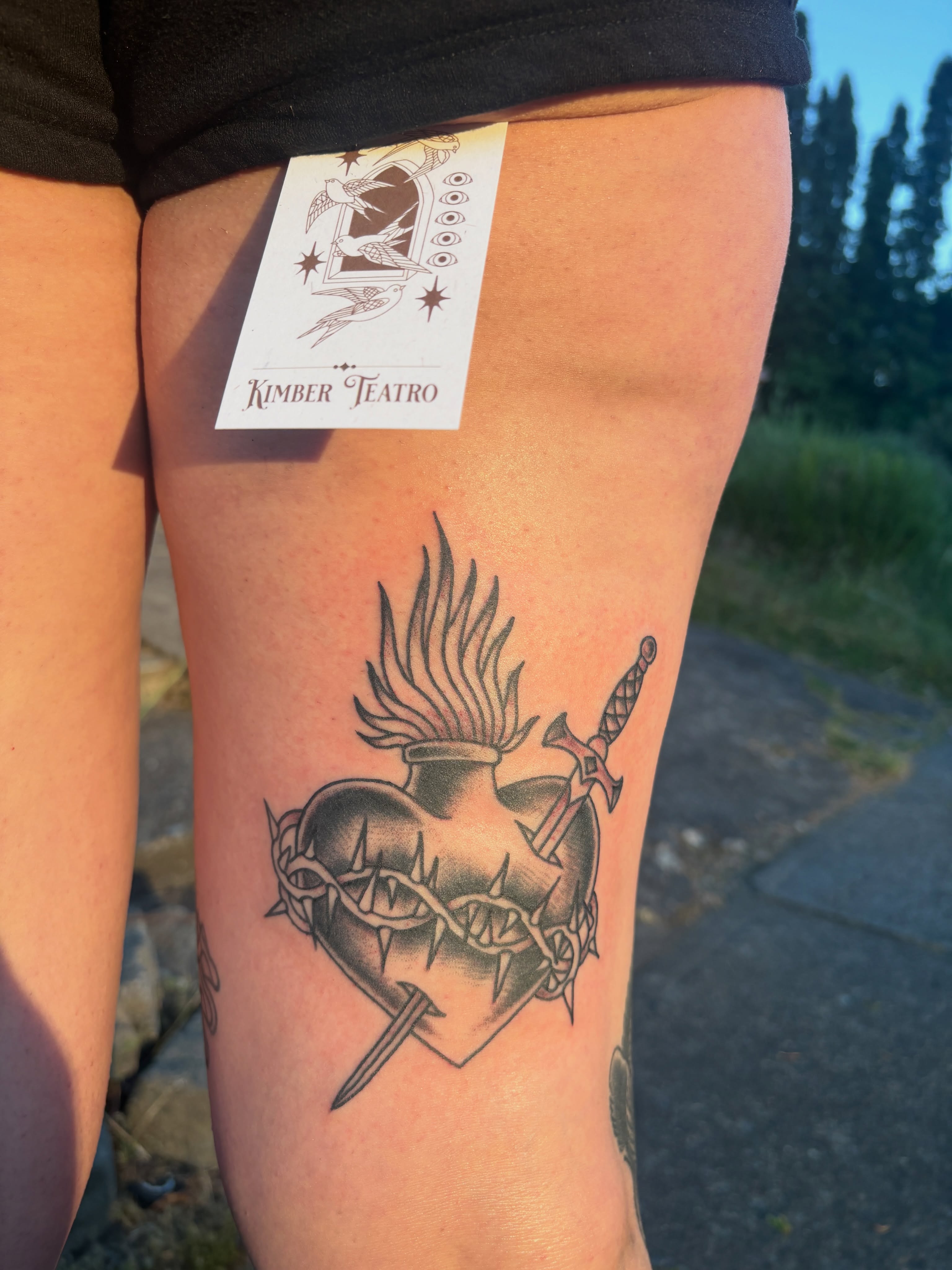 Heart and crown of thorns black and grey tattoo on the thigh by Kimber Teatro, Portland, Oregon