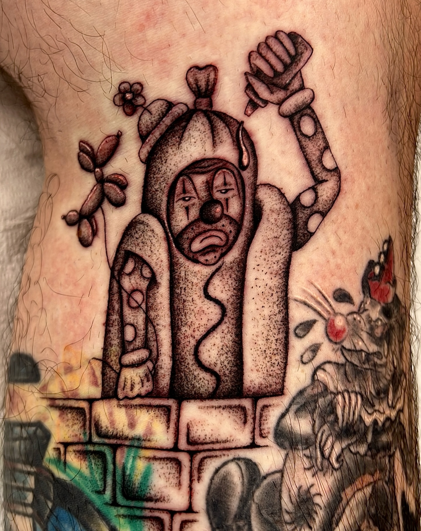 Clown in chimney dotwork tattoo on the thigh by David Delacruz