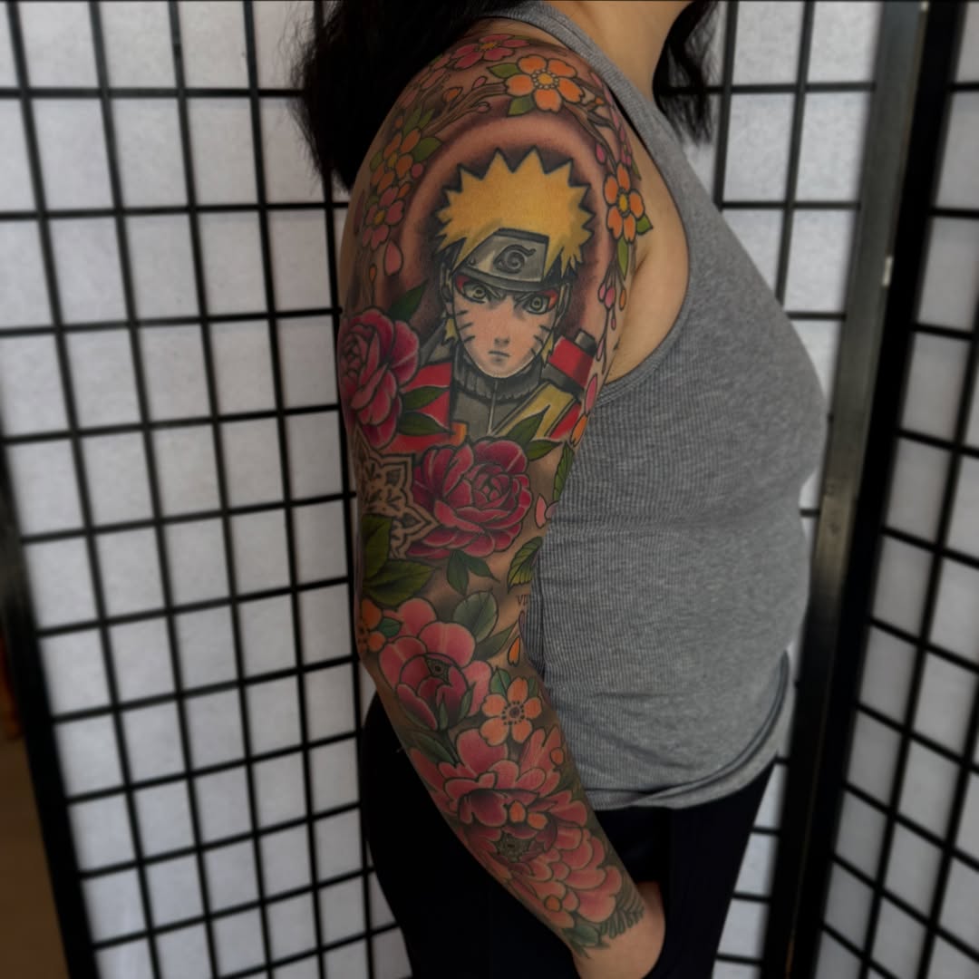 Naruto anime tattoo on the upper arm by Kaley, Des Moines, Iowa