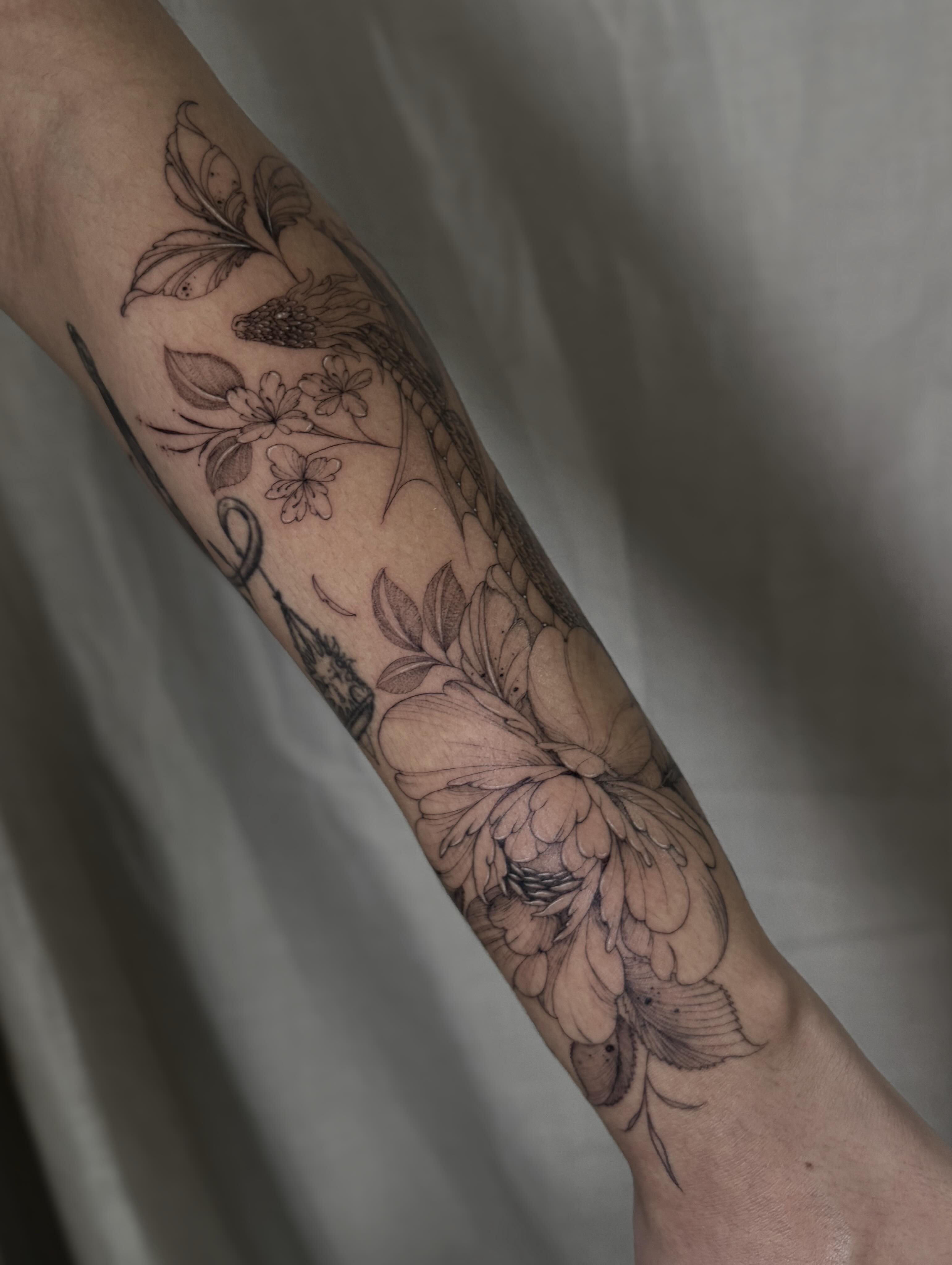 Floral arrangement realism tattoo on the forearm by Justene Renee 🖤 Fine Line Tattoo Artist