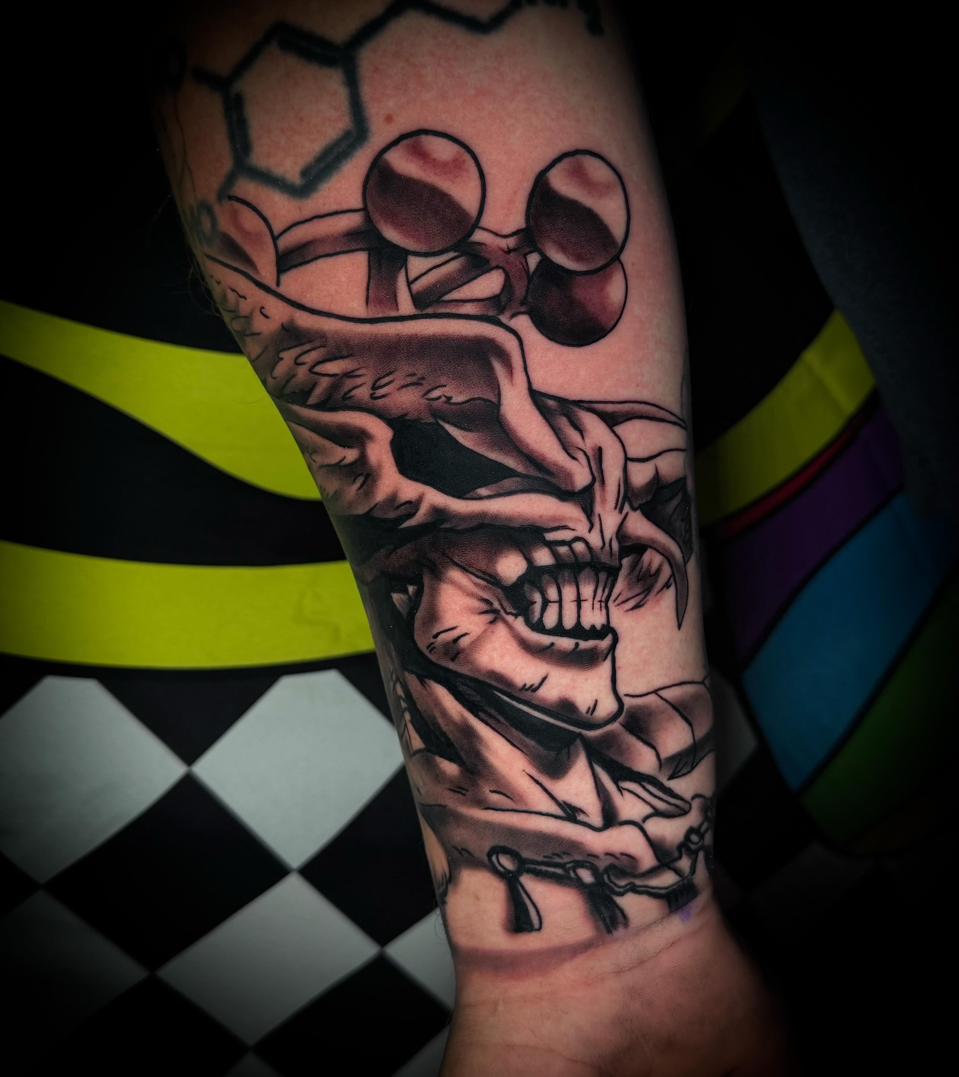 Skull black and grey tattoo on the forearm by Savannah Duff