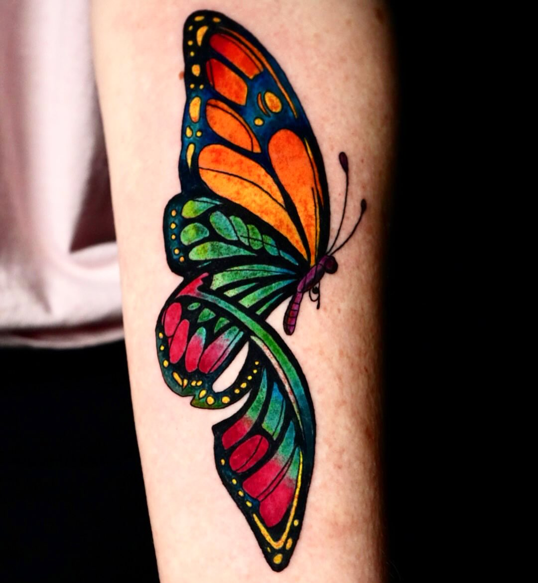 Butterfly new school tattoo on the forearm by Rayvin Patton