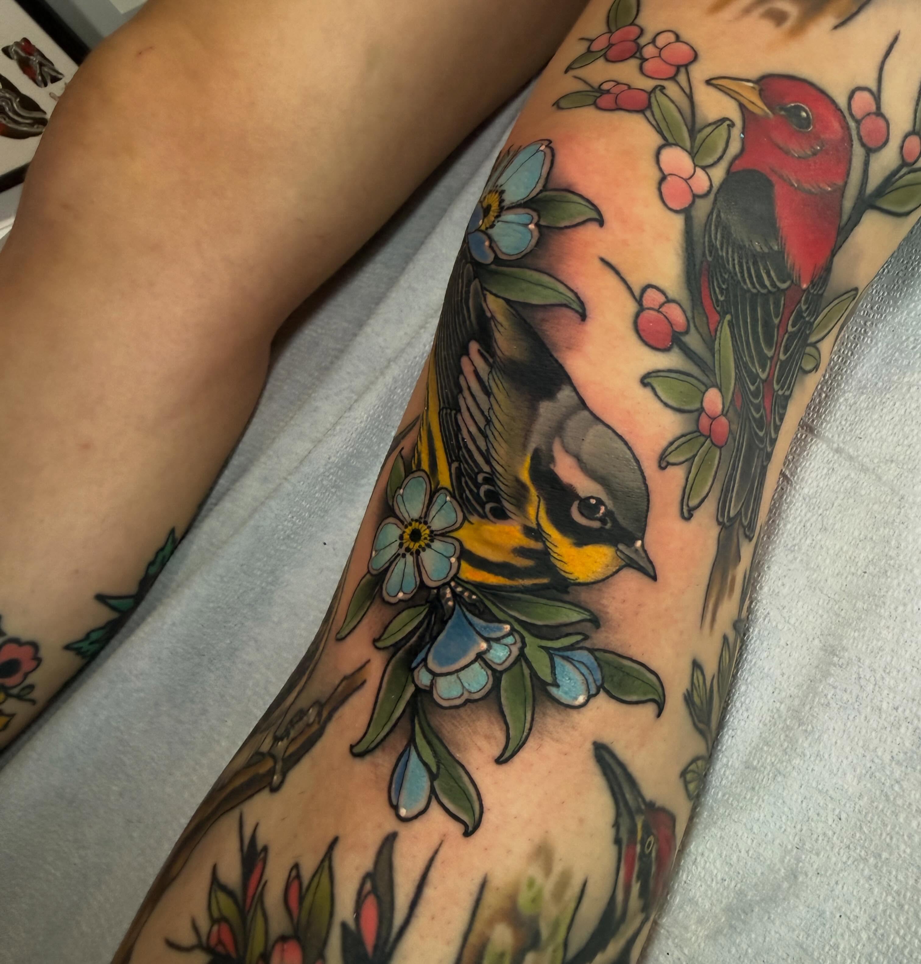 Birds and flowers American traditional tattoo on the forearm by Kyle Behr