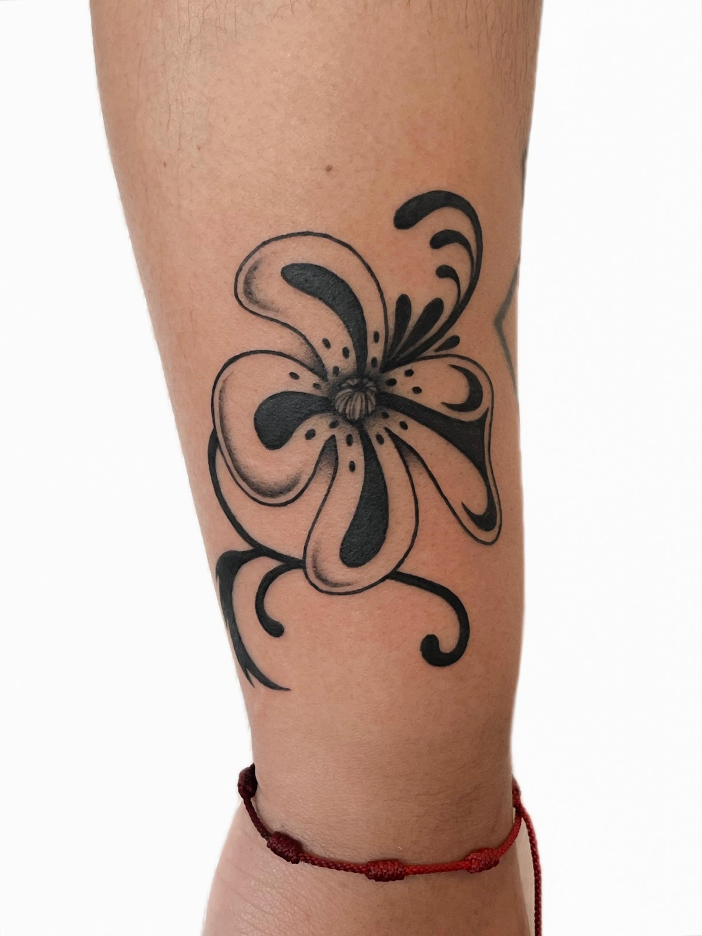 Flower black and grey tattoo on the forearm by nina