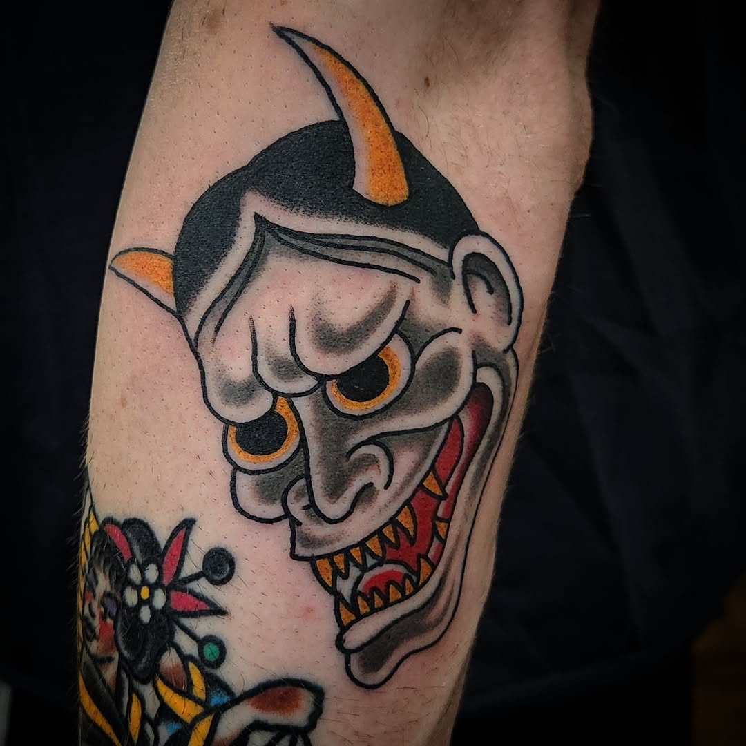 Oni mask Japanese tattoo on the forearm by Douglas Grady