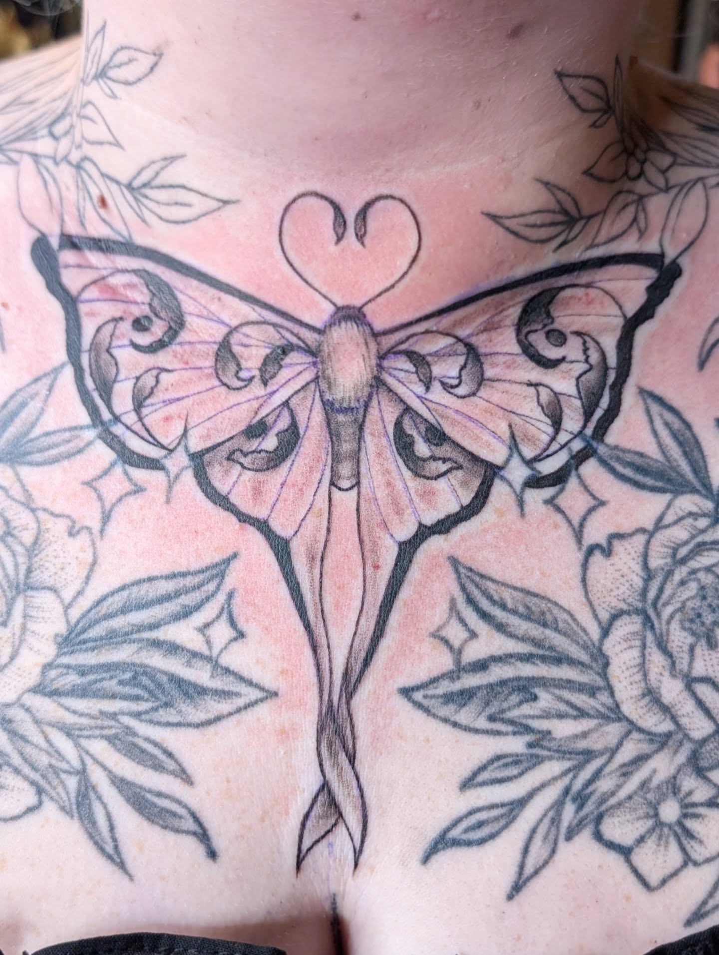 Butterfly American traditional tattoo on the chest by Michaela May