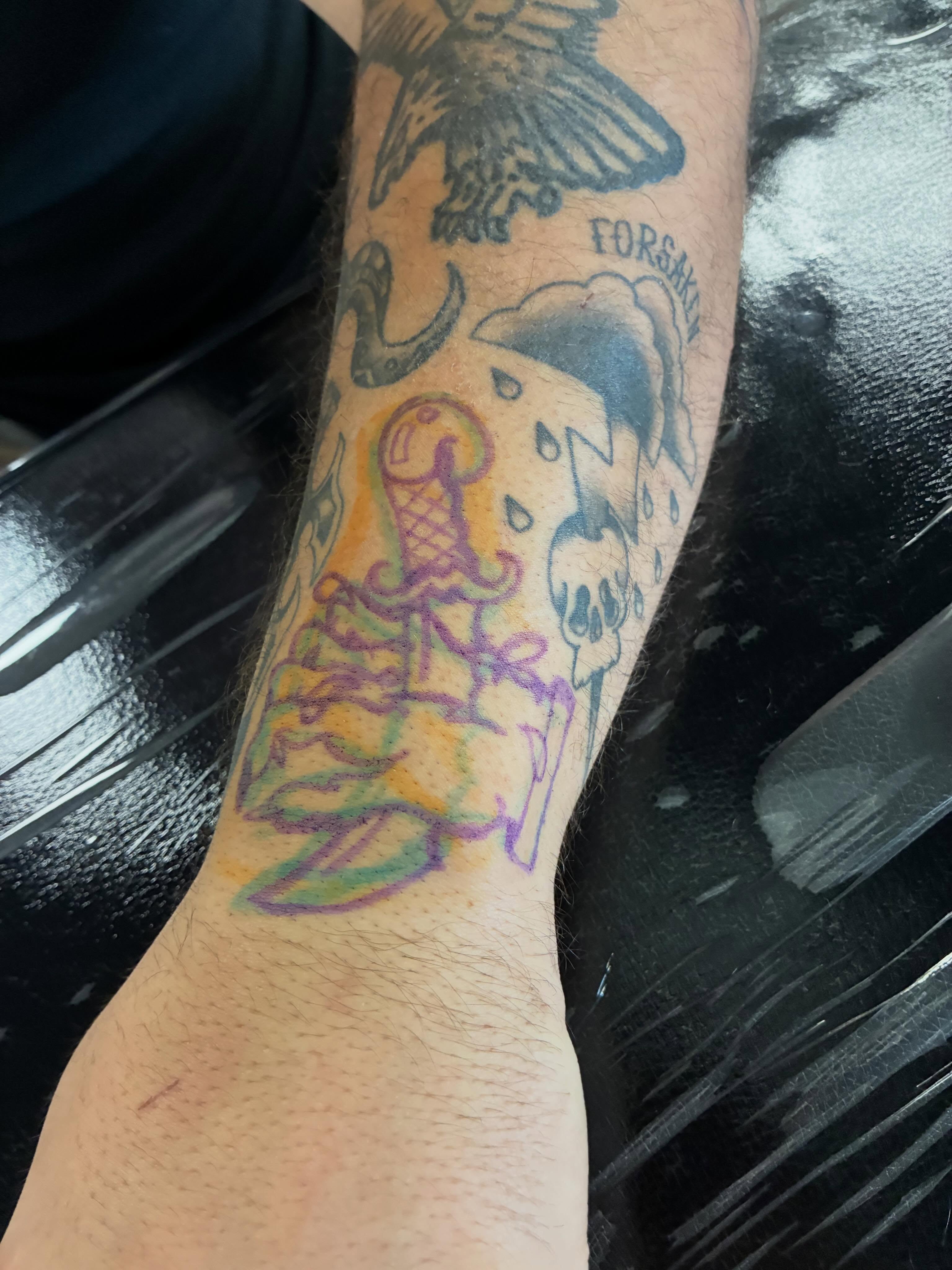 Bird and skull American traditional tattoo on the forearm by Hit & Run Tattoo, Dayton, Ohio