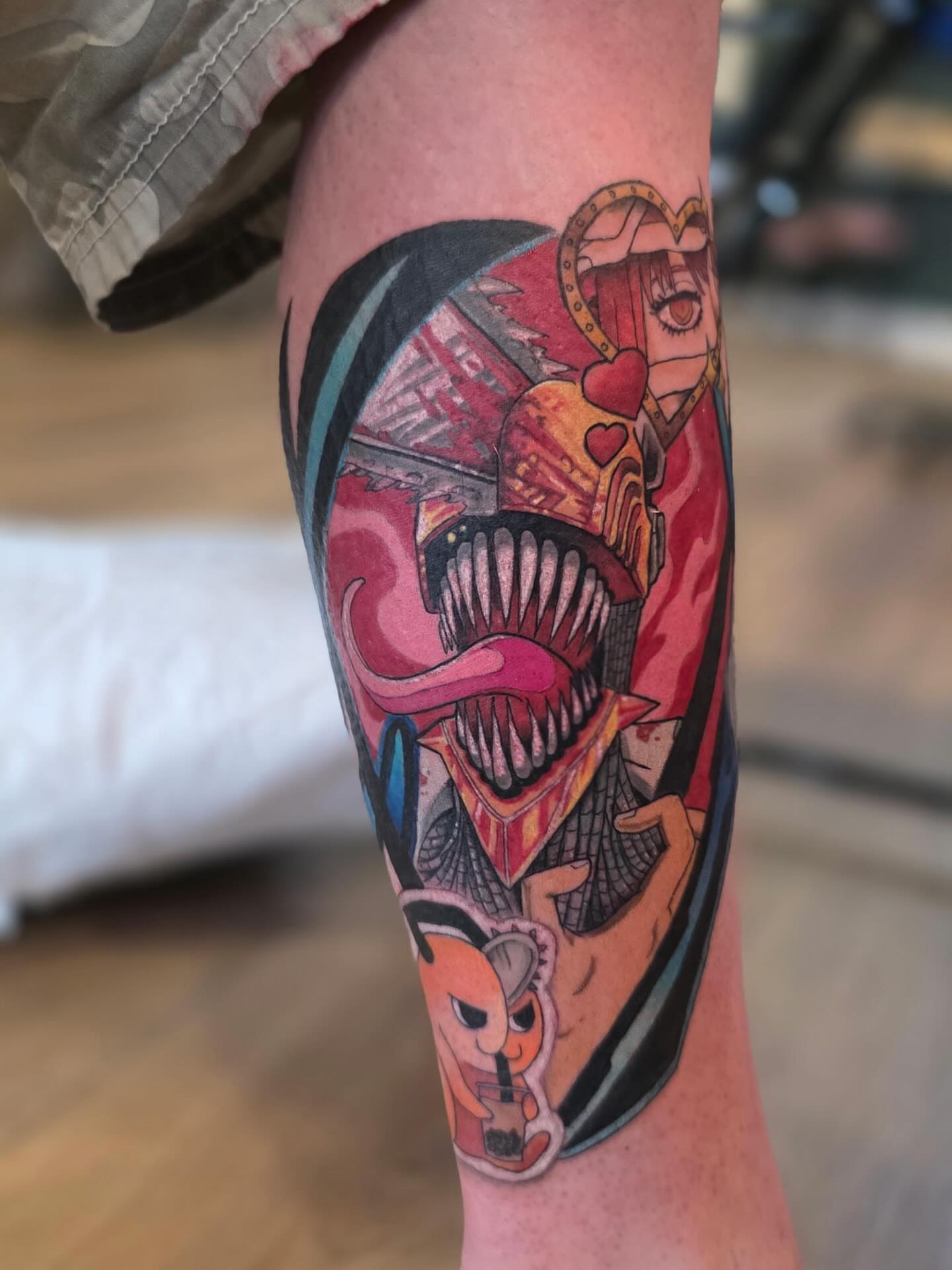 Joker and anime character new school tattoo on the forearm by Krystal Harris