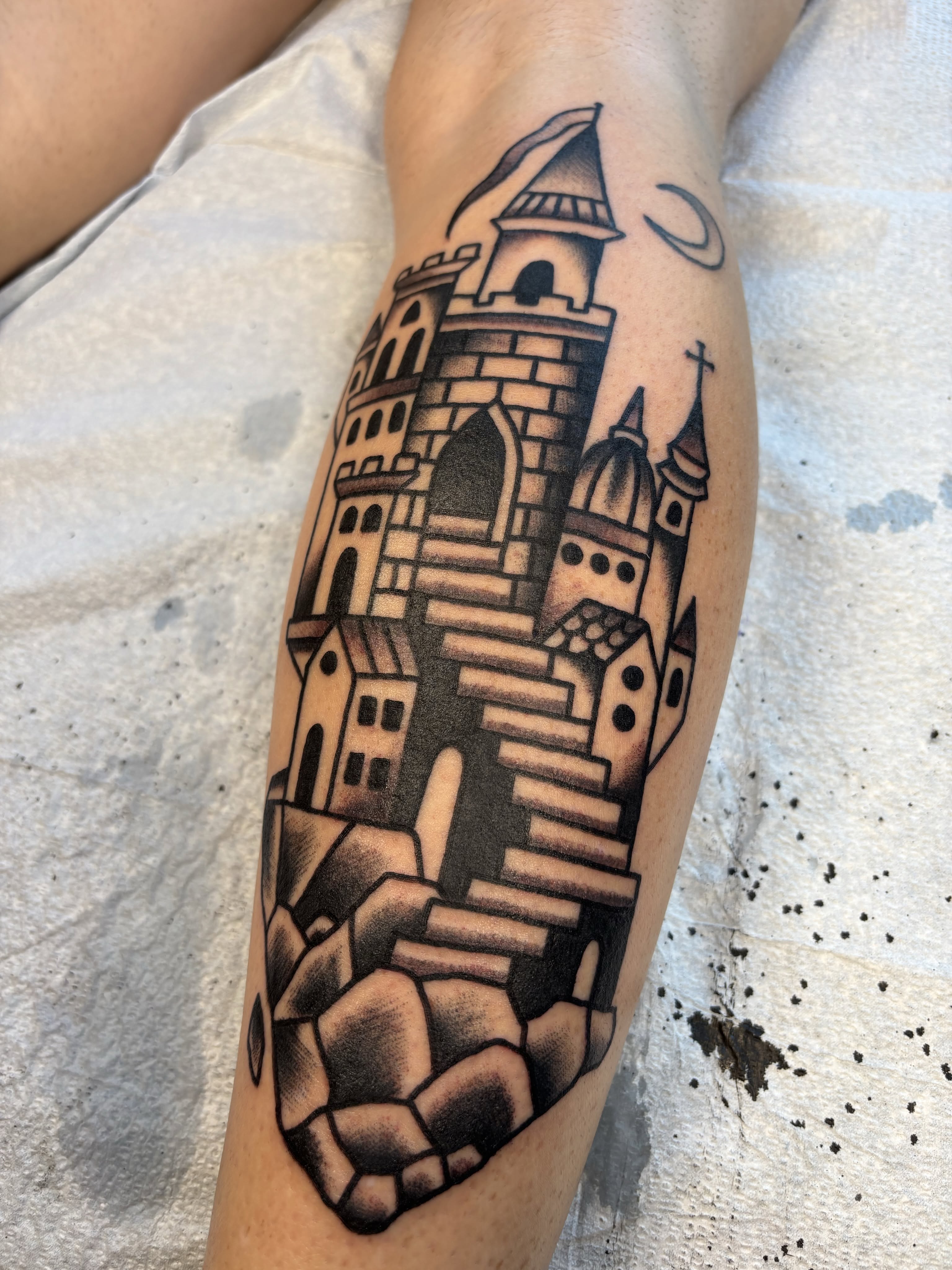 Castle black and grey tattoo on the forearm by Jeff Slack
