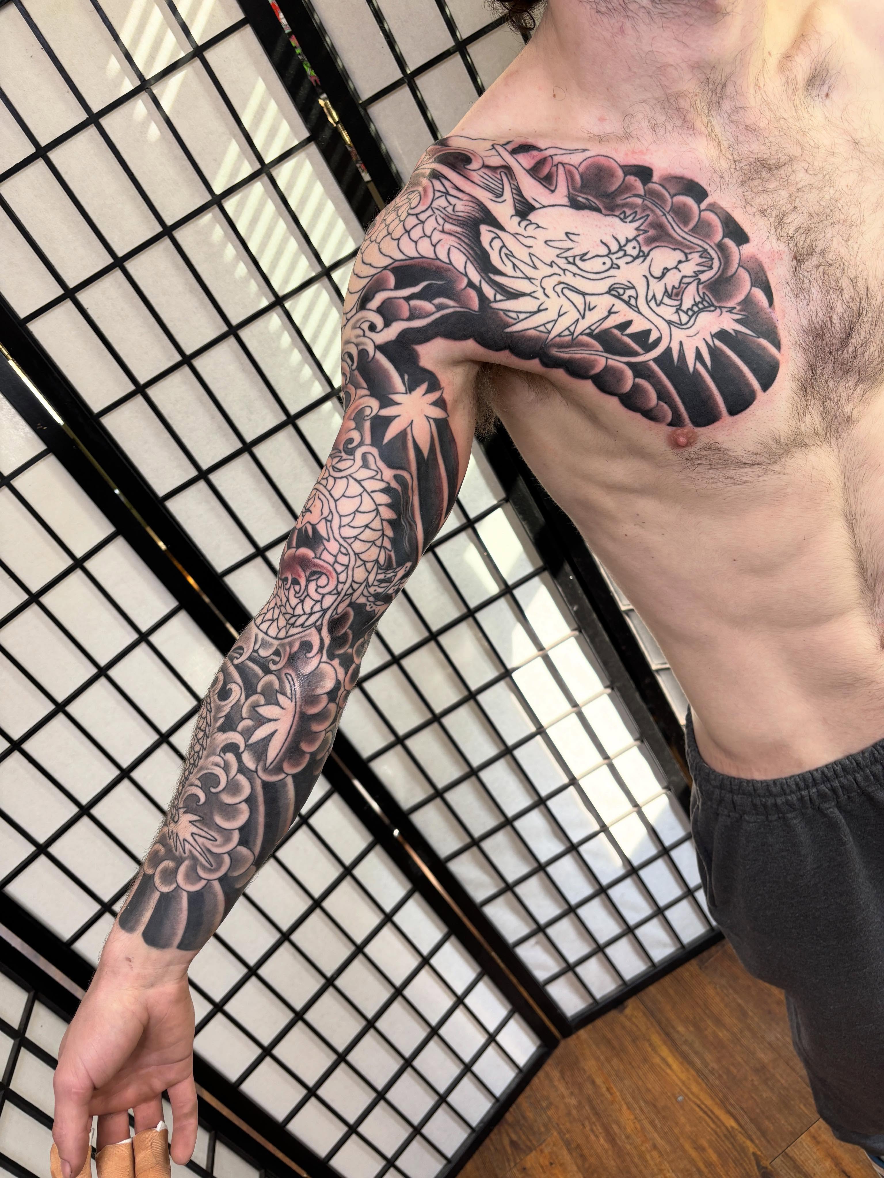 Dragon japanese irezumi tattoo on the upper arm by Mike DiCicco