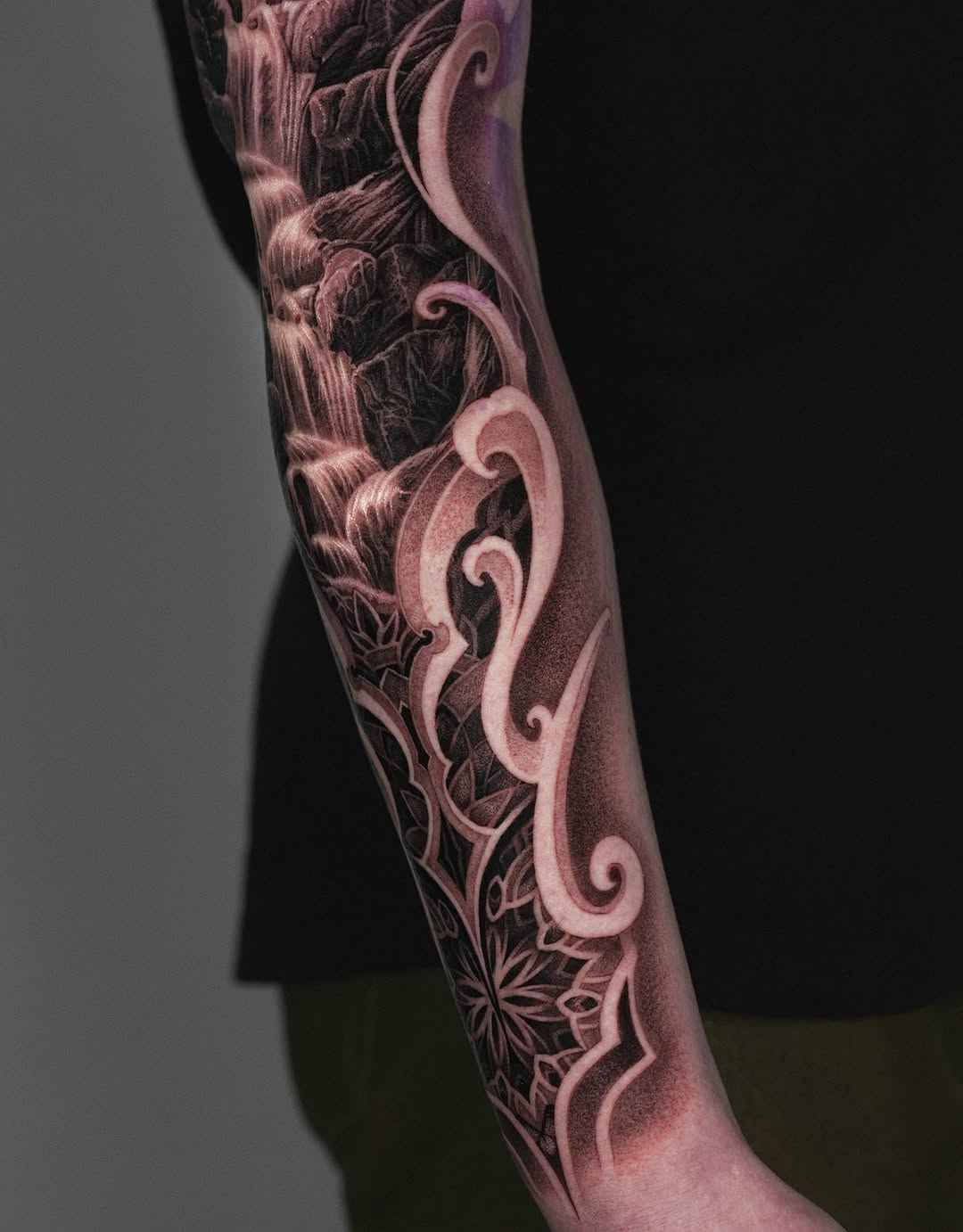 Waterfall and mandala Japanese tattoo on the forearm by Sumok Kim