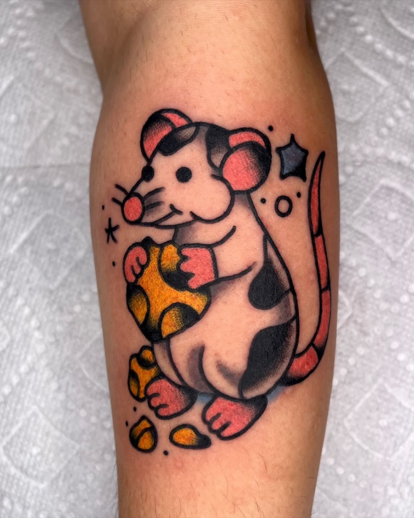 Mouse American traditional tattoo on the forearm by Robyn Fricke