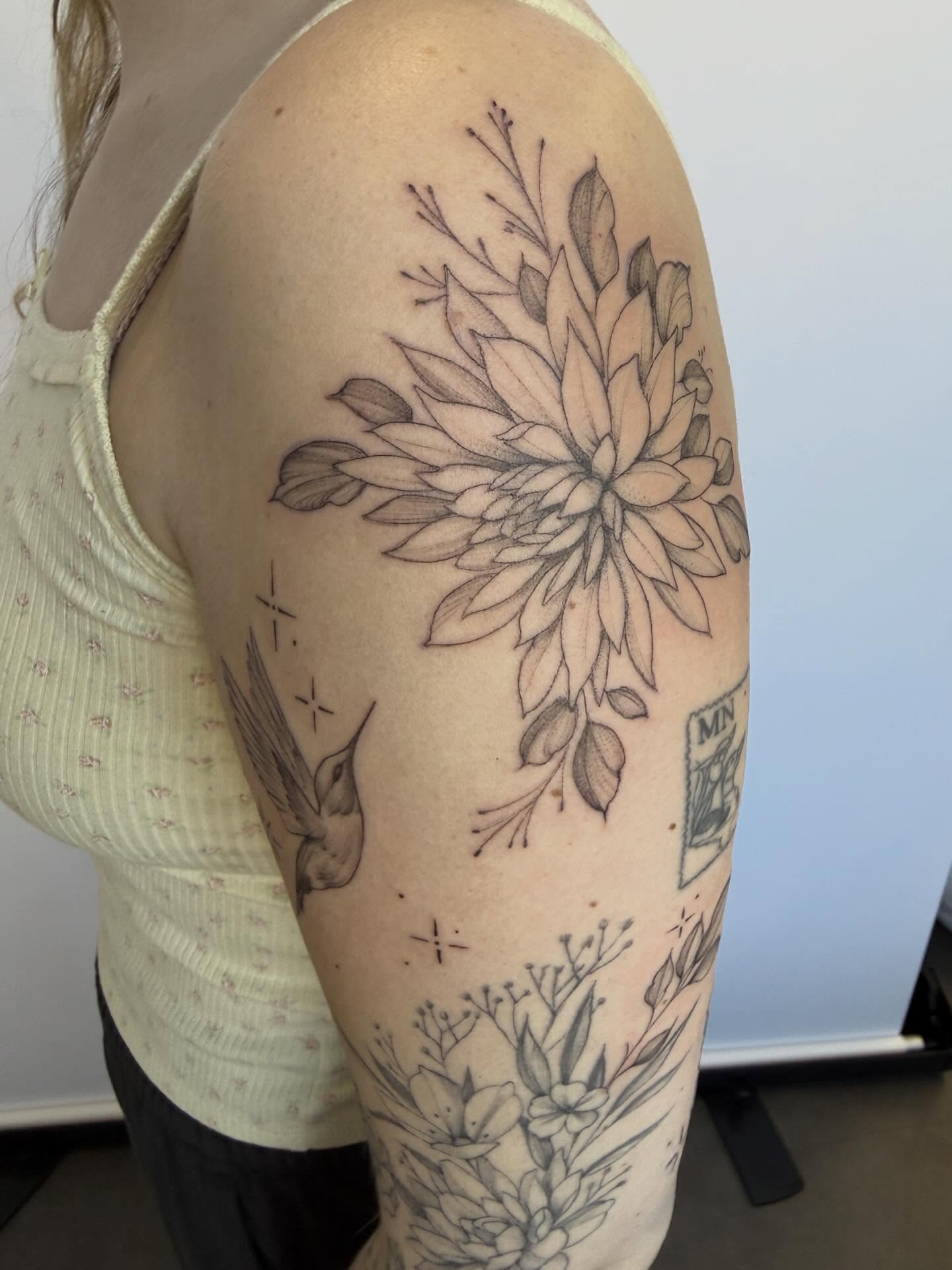 Floral bouquet dotwork tattoo on the shoulder by Peter Harren