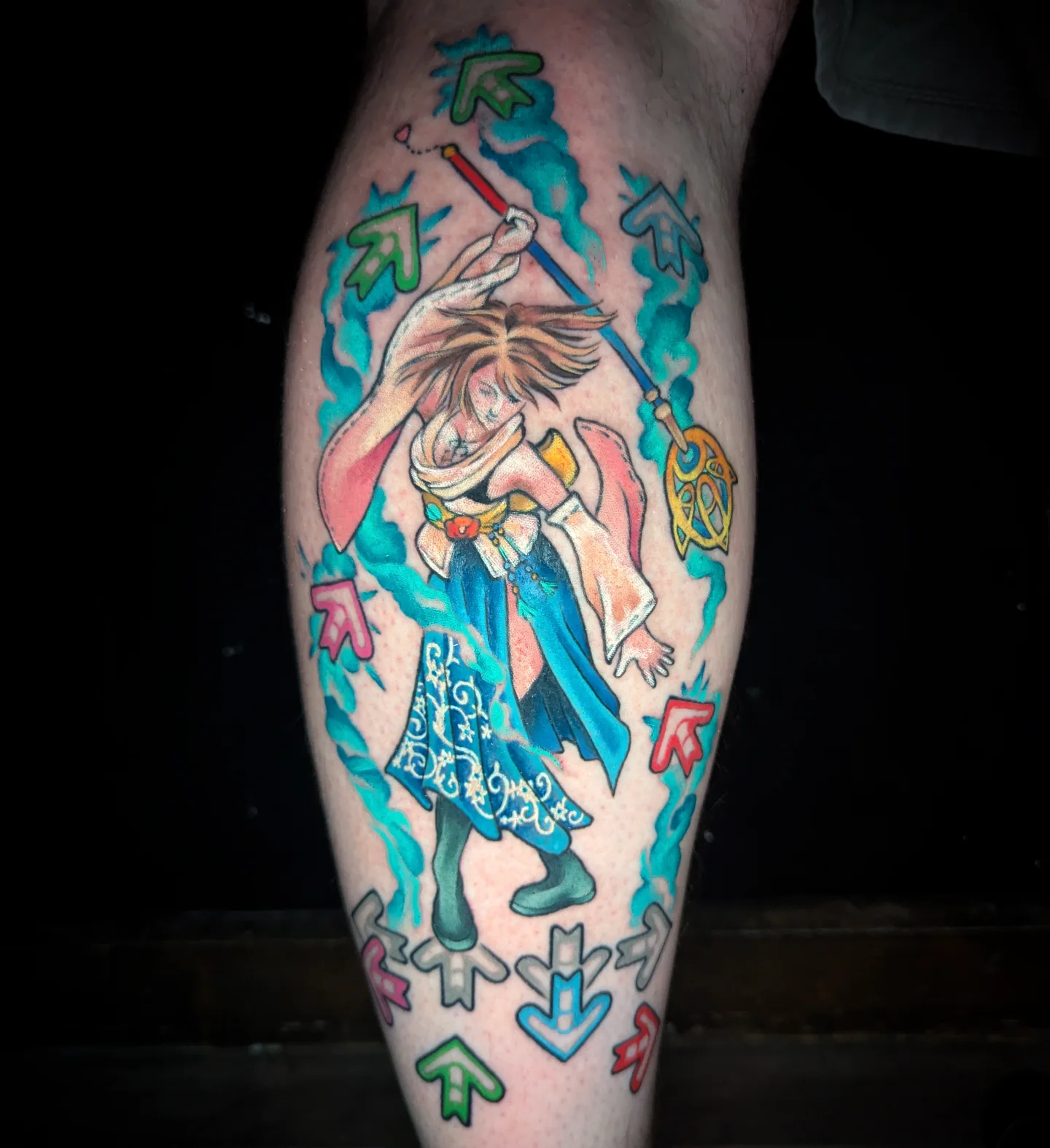 Fantasy character watercolor tattoo on the leg by Devon Greig
