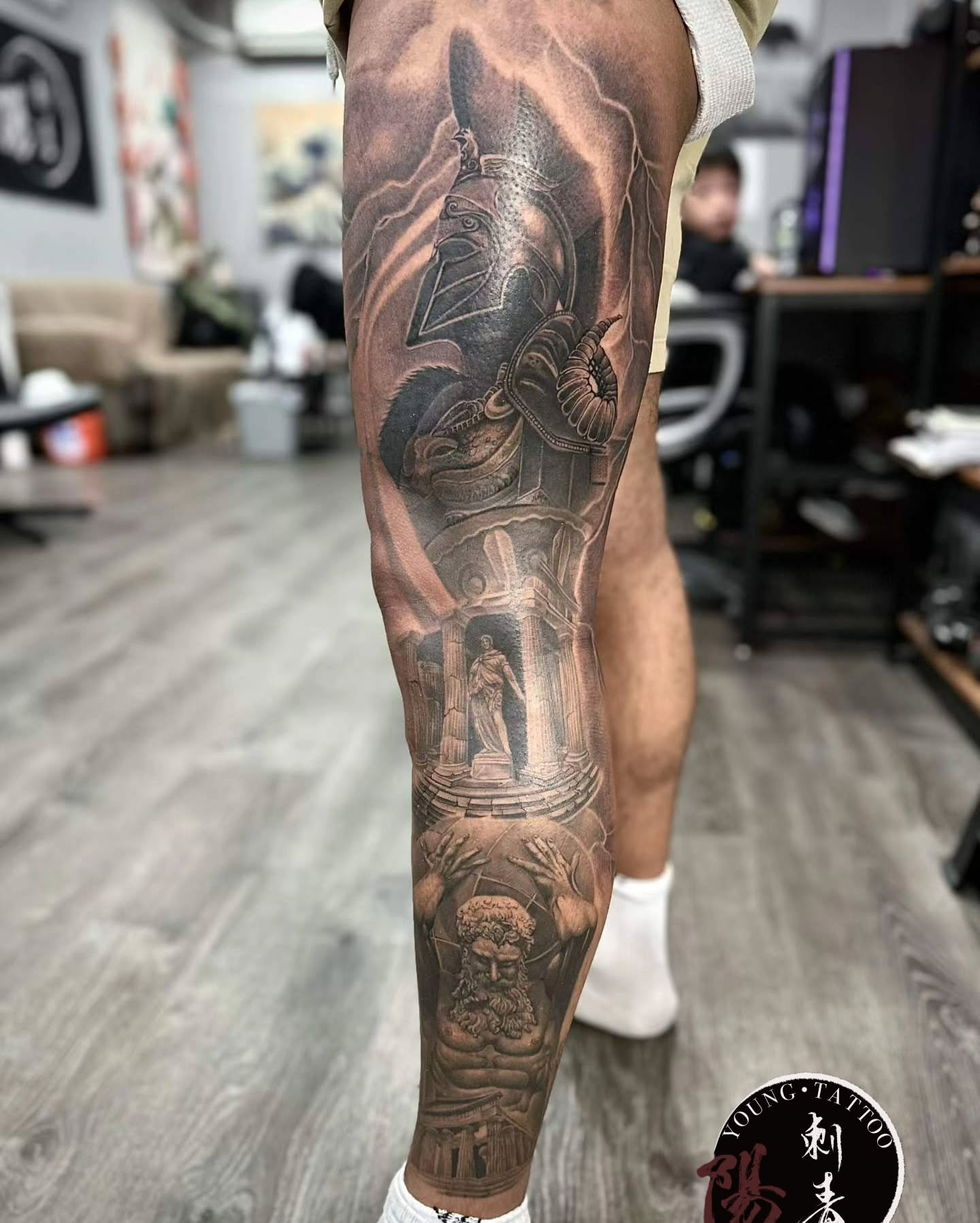 Mythical warrior and statue realism tattoo on the forearm by Ying