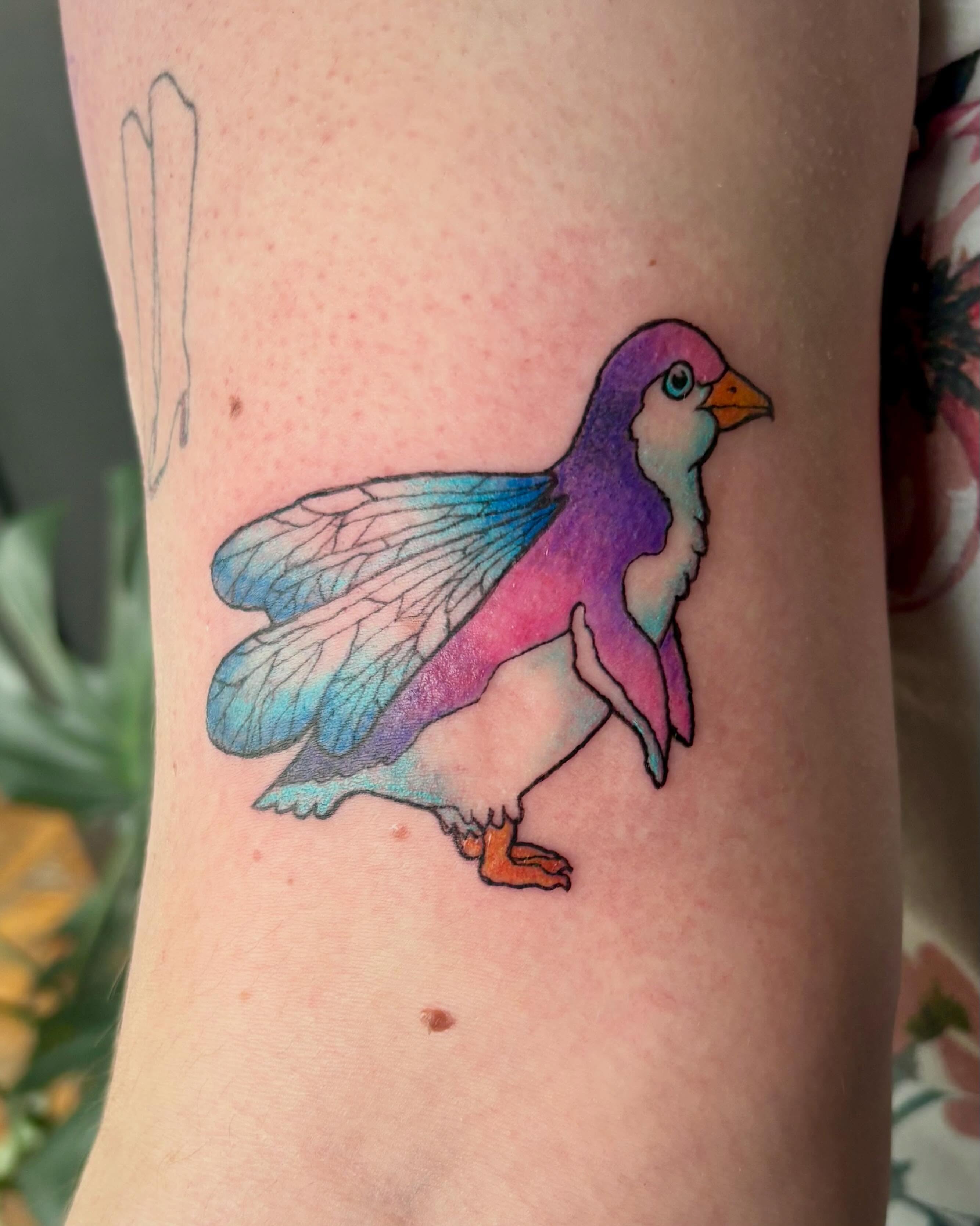 Bird watercolor tattoo on the forearm by Abby Ruok, Midvale, Utah