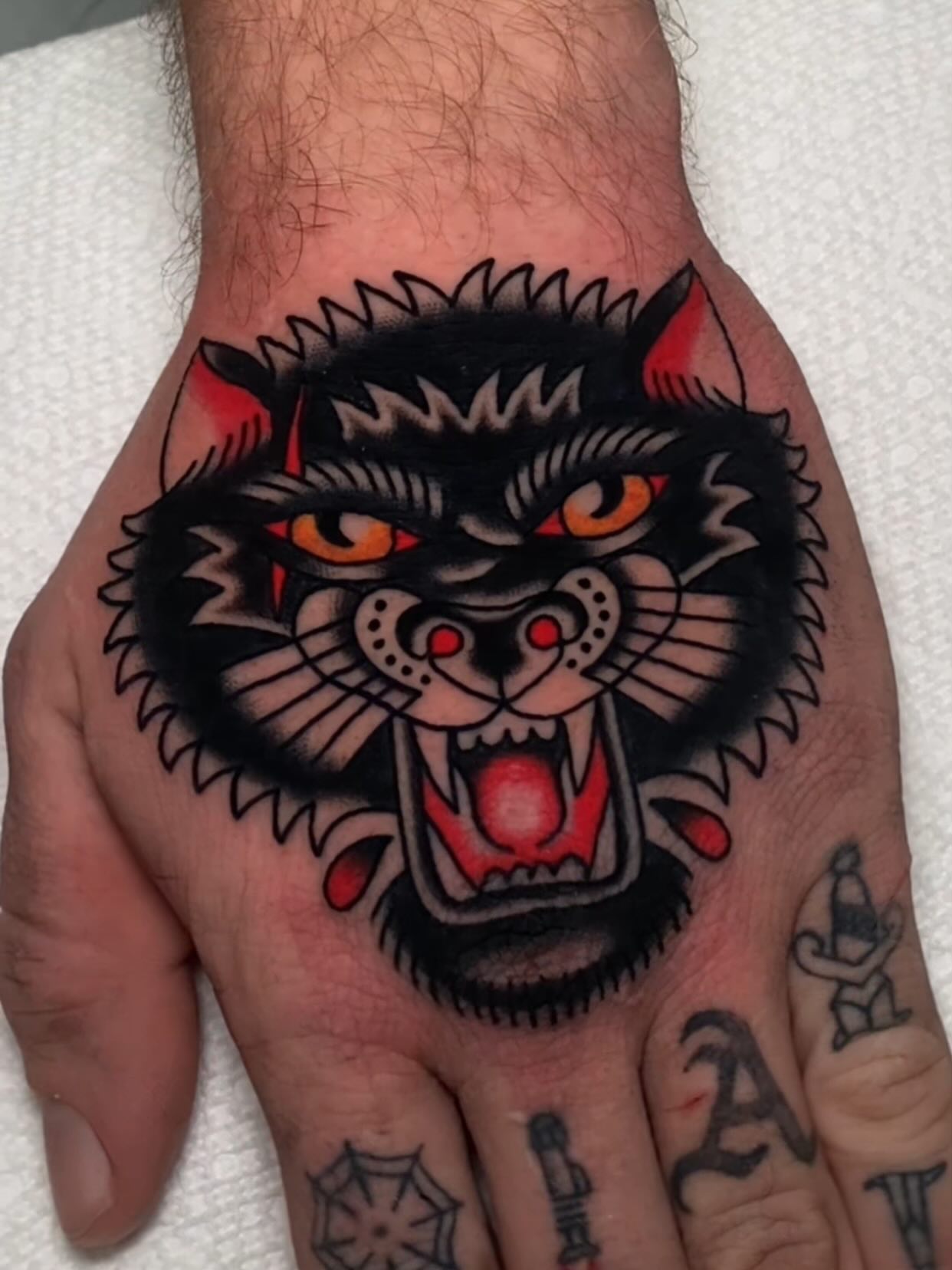 Panther American traditional tattoo on the hand by Justin R. Mitchell, Fort Worth, Texas