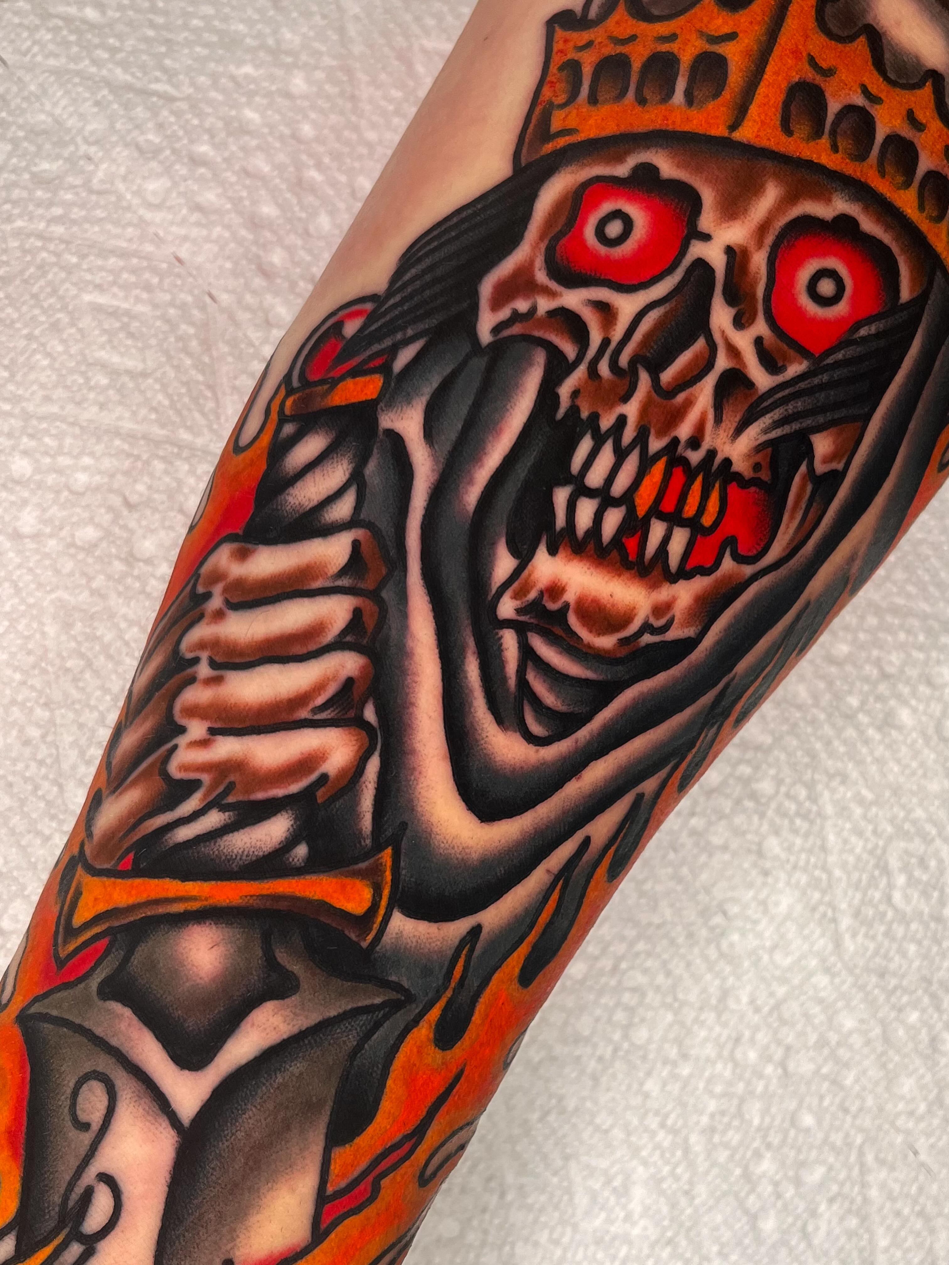 Skull with crown American traditional tattoo on the forearm by Sky G, Colorado Springs, Colorado