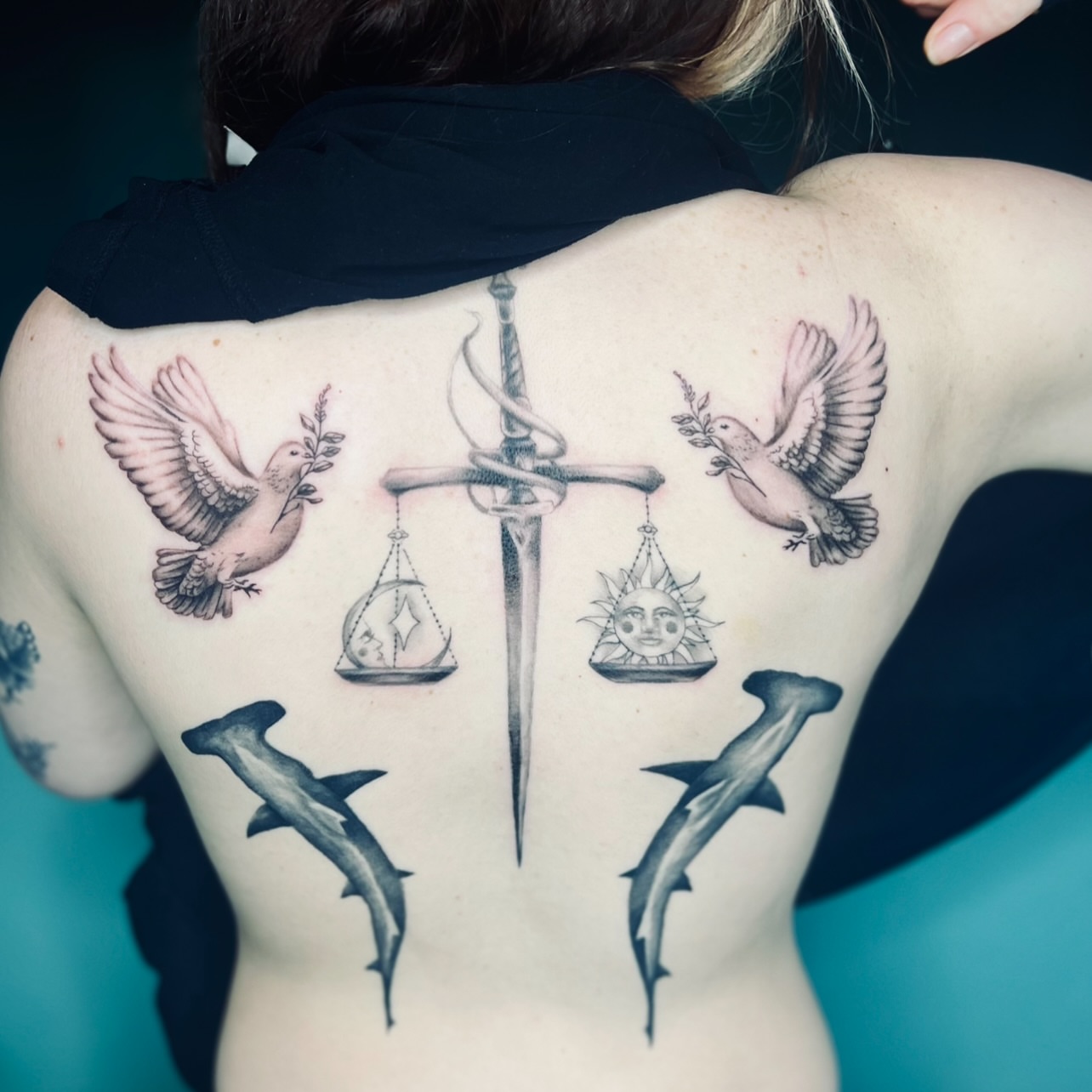Balance scales with sword realism tattoo on the back by Sydney Rose