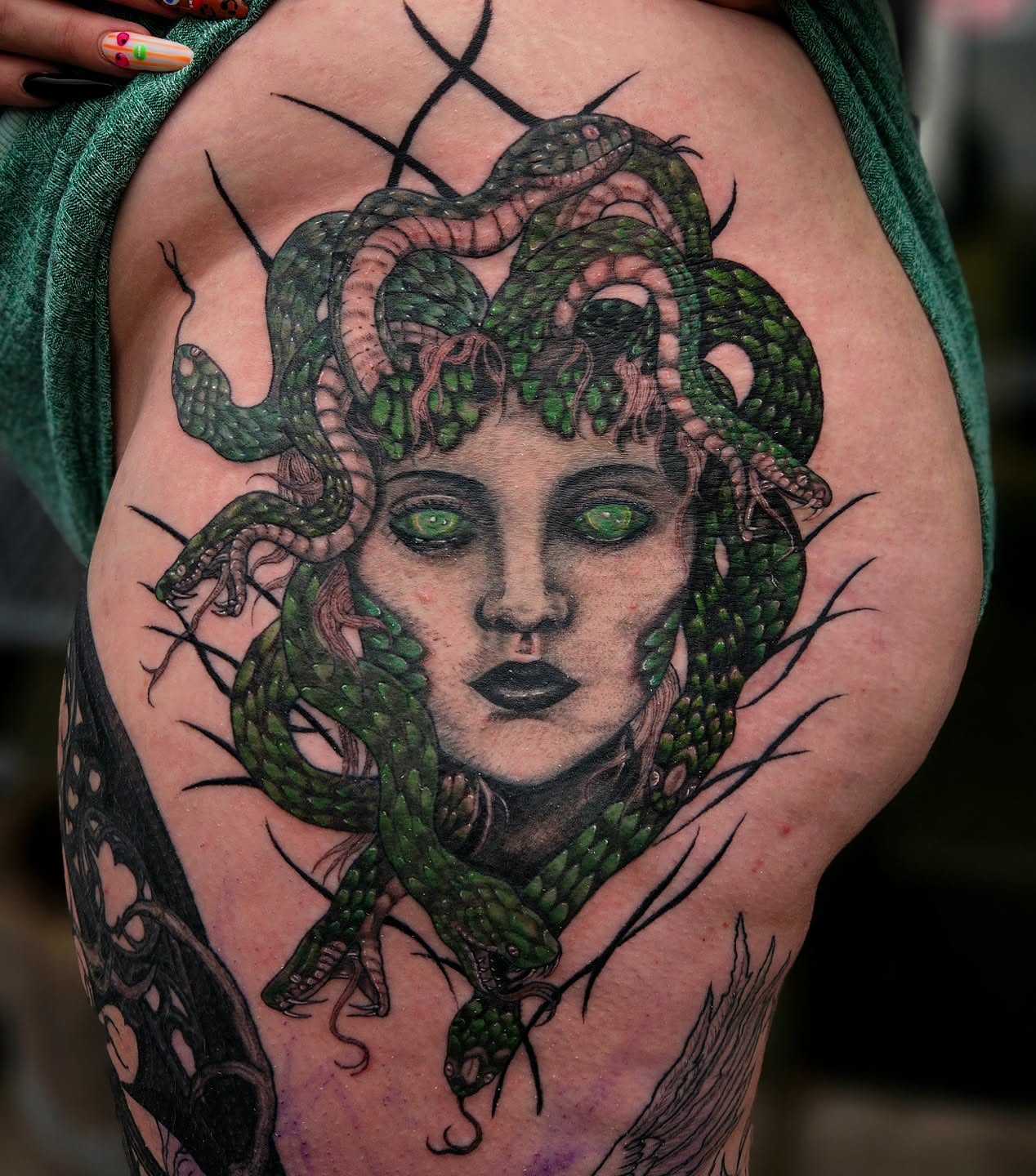 Medusa realism tattoo on the thigh by Ashly Renee