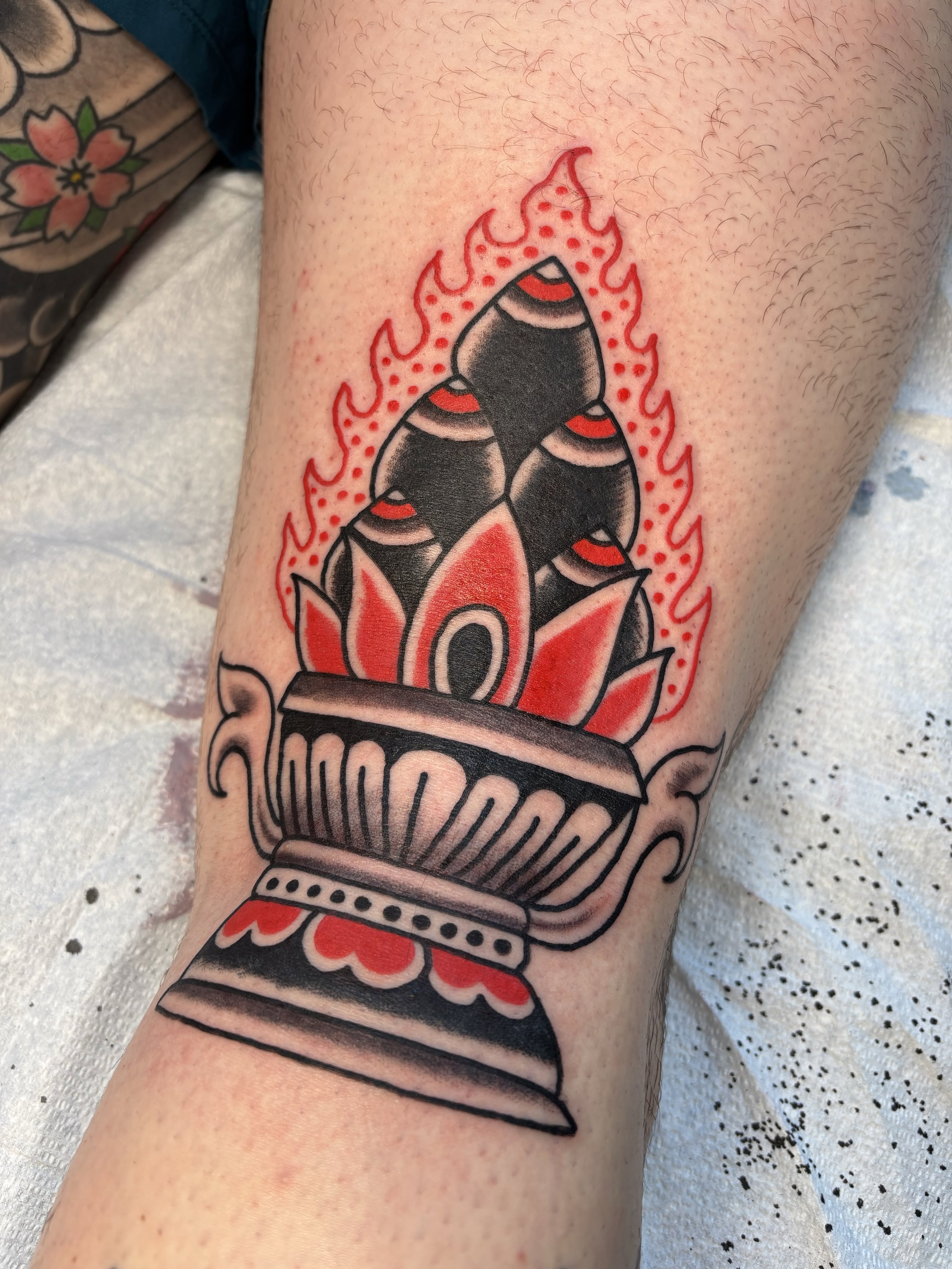 Lotus flower American traditional tattoo on the forearm by Jeff Slack