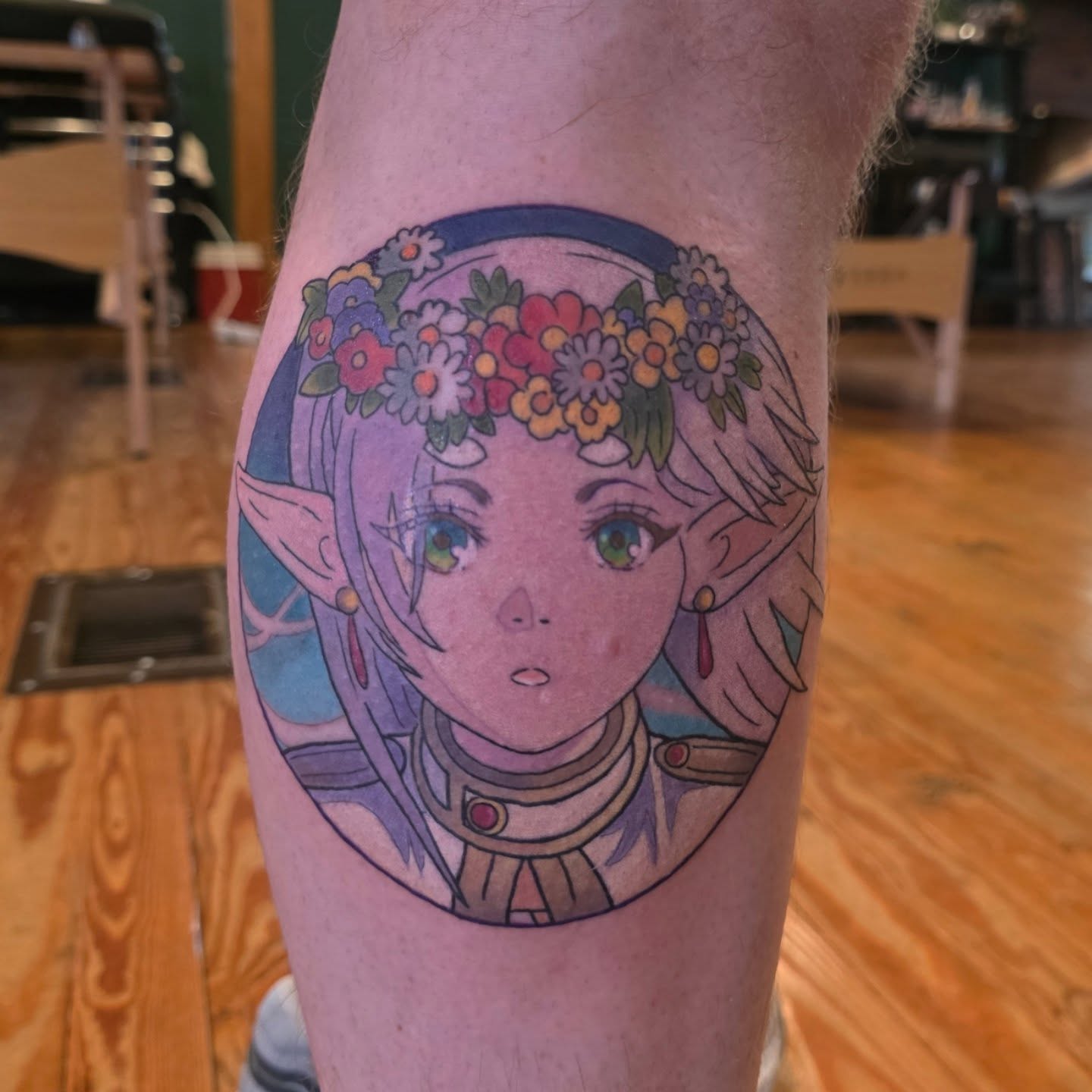 Elf girl with floral crown anime tattoo on the forearm by Kayla Williams