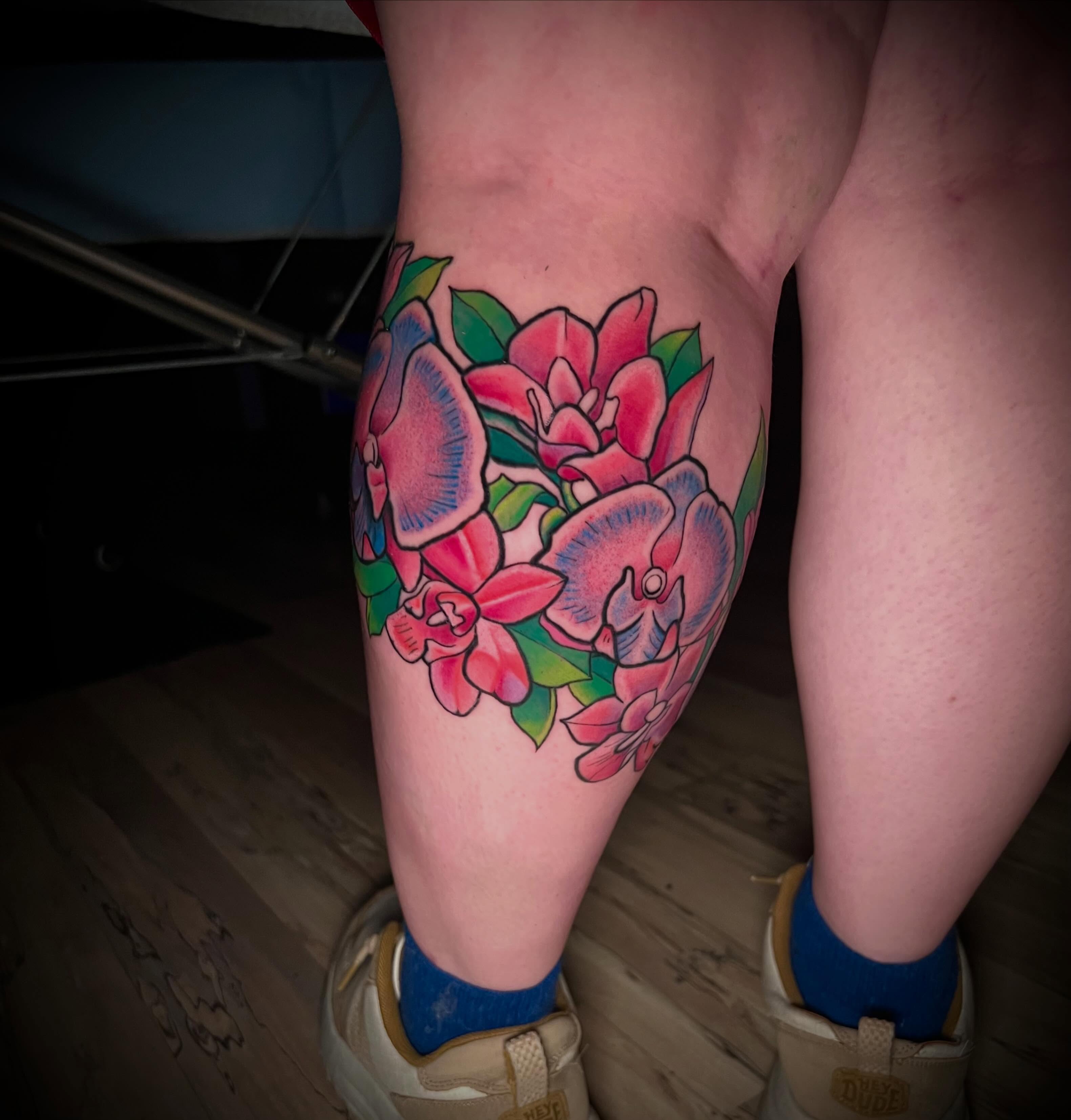 Floral bouquet American traditional tattoo on the thigh by James Richardson