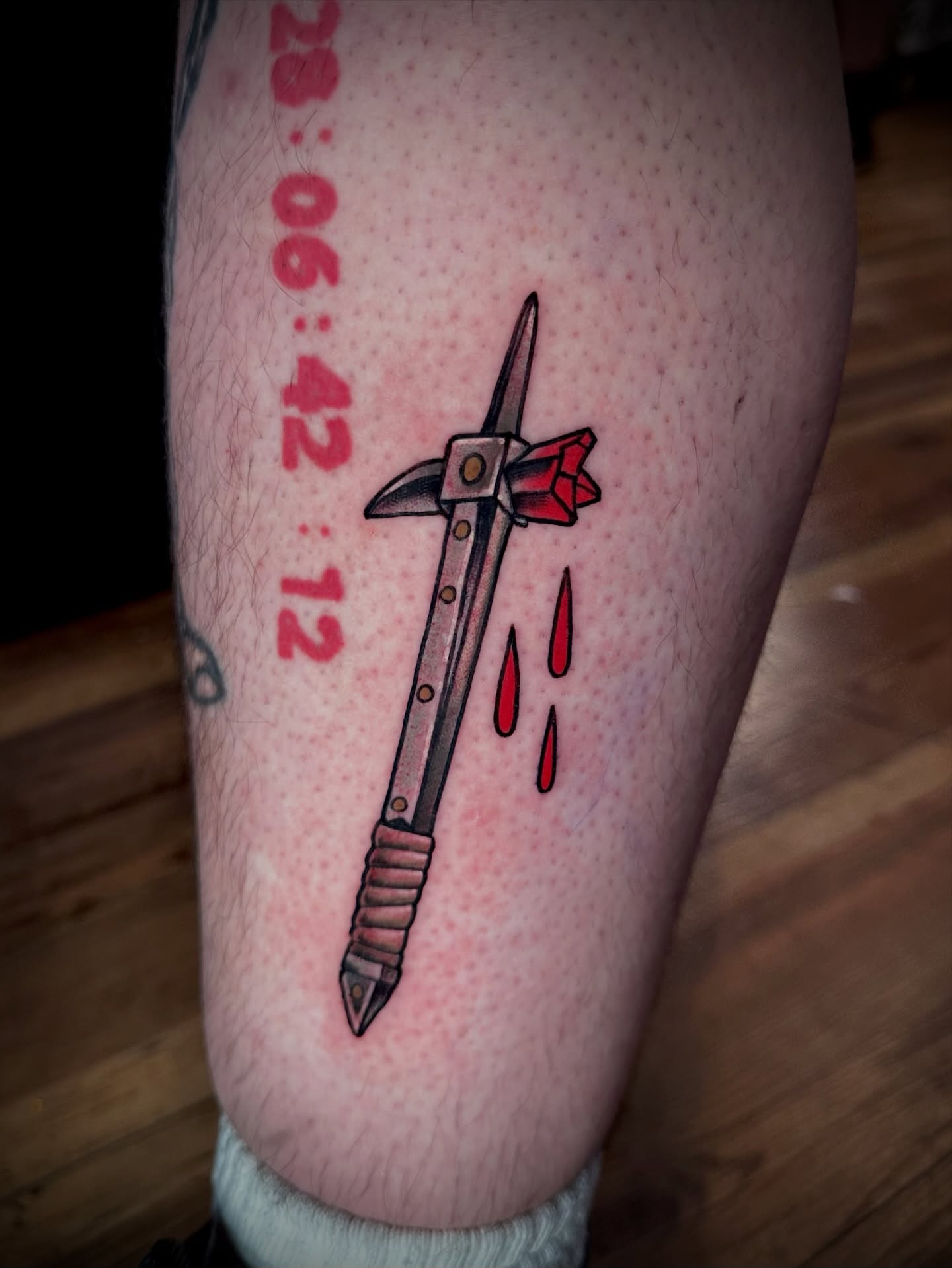 Crossbow neo-traditional tattoo on the forearm by Teddi Garson