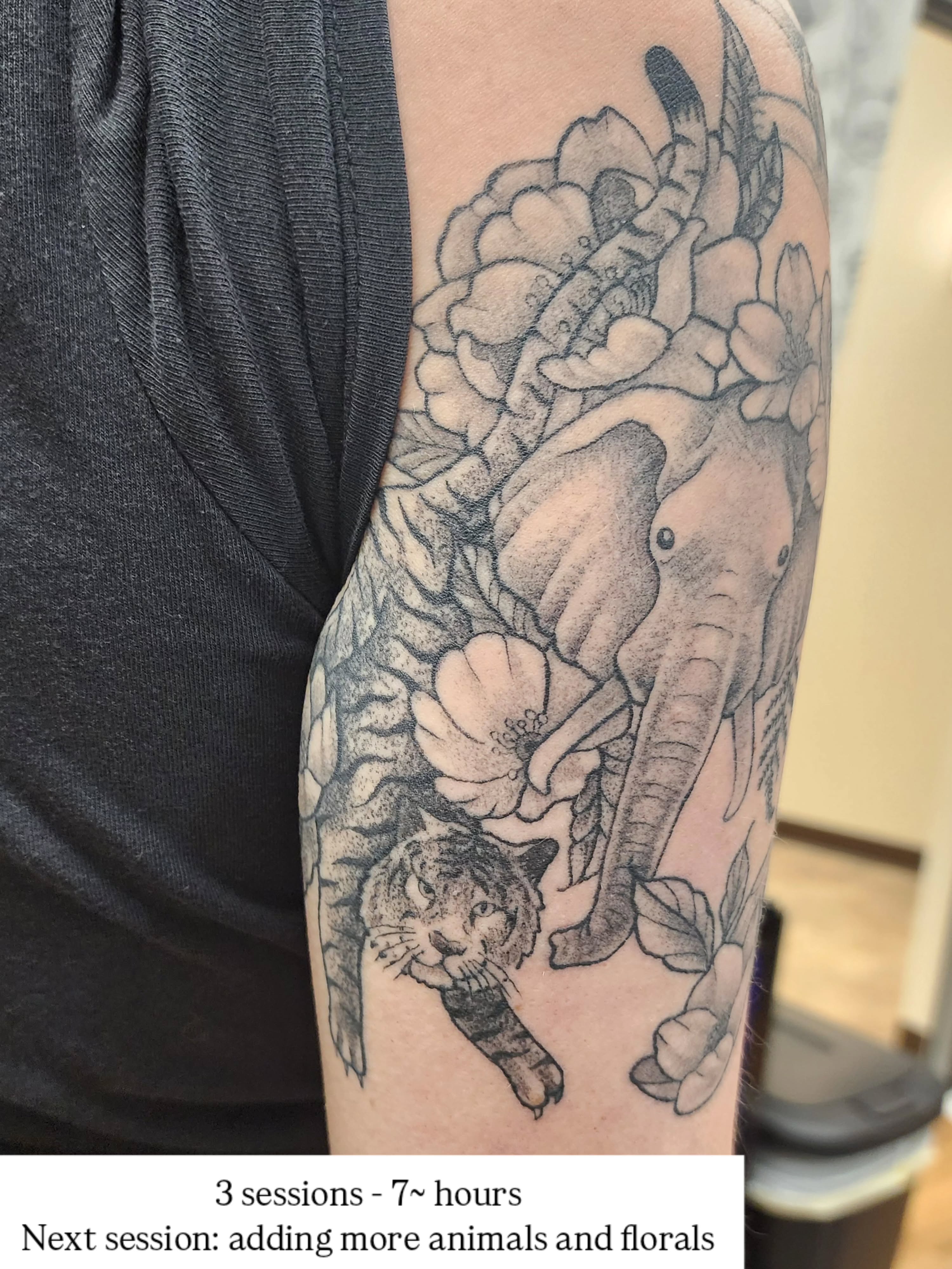 Elephant and tiger black and grey tattoo on the forearm by Lindsey Andrew, Englewood, Colorado