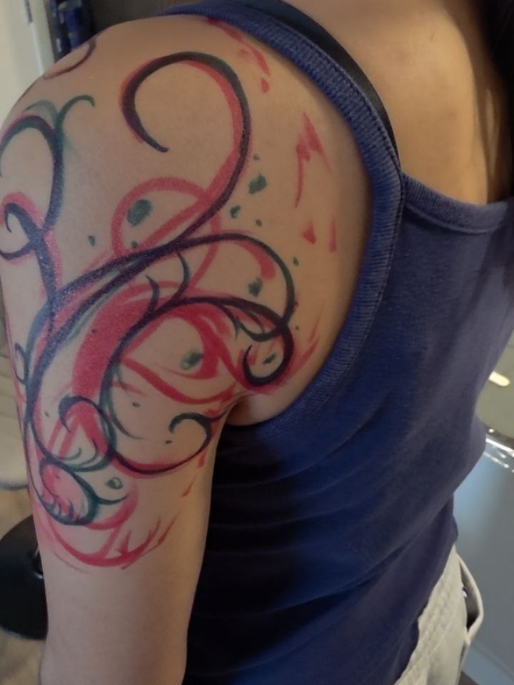 Abstract swirls watercolor tattoo on the shoulder by Claudia Isabel Roman, El Paso, Texas