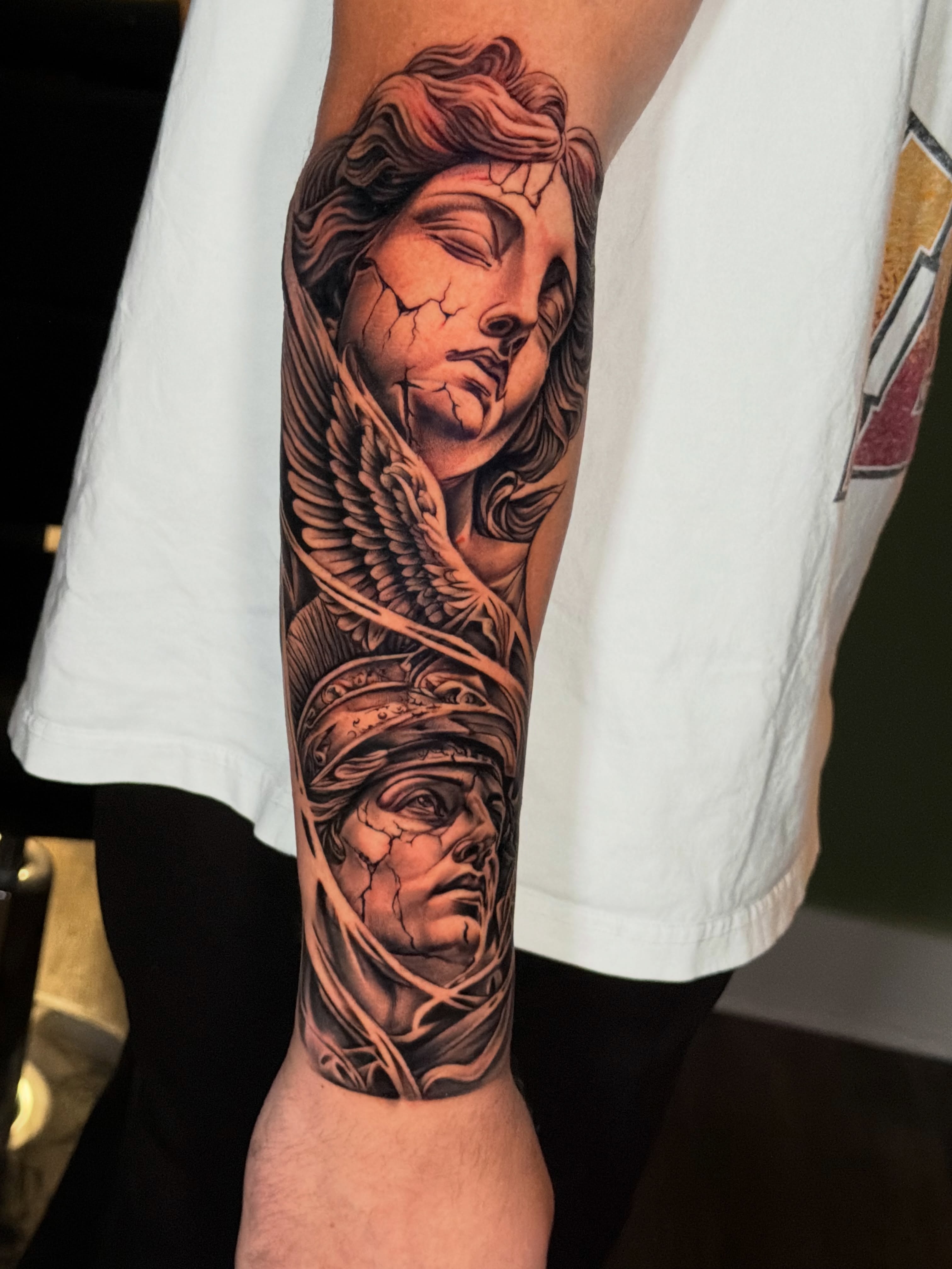 Angel and woman realism tattoo on the forearm by Ray Paponetti - Tattoo Artist Delray Beach