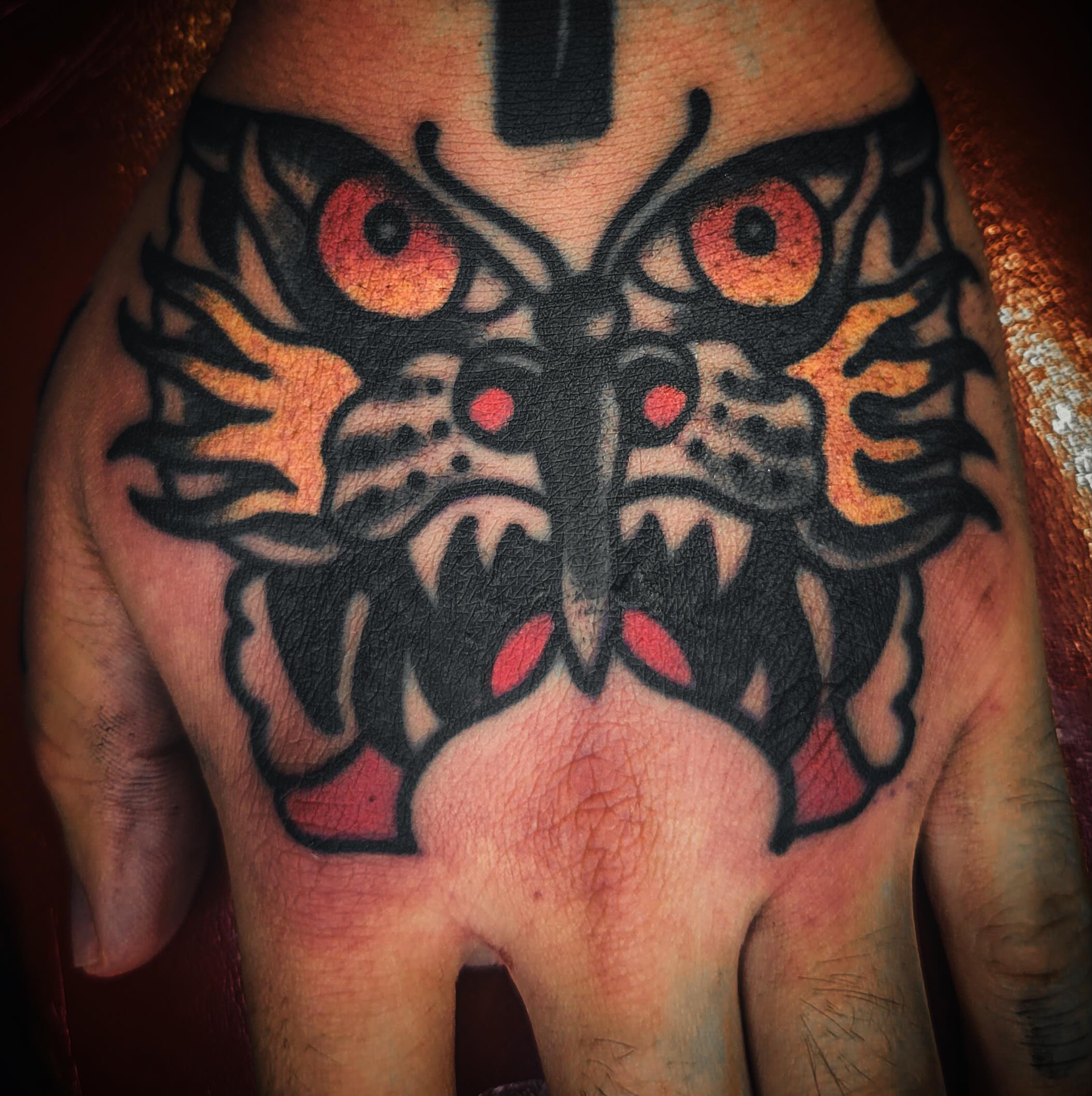 Butterfly American traditional tattoo on the hand by joe martinez, Denver, Colorado