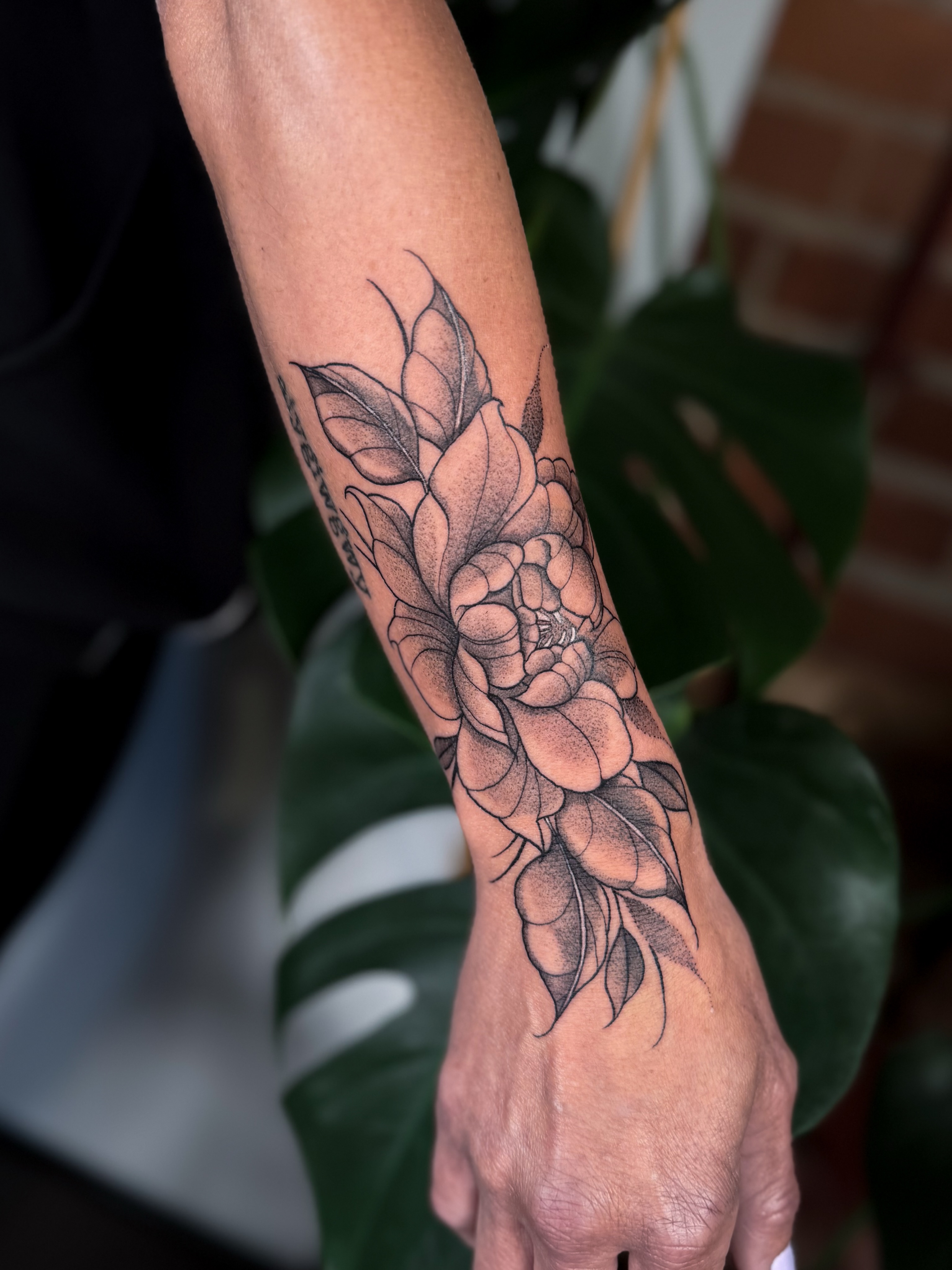 Floral bouquet dotwork tattoo on the forearm by Jessica Bloom