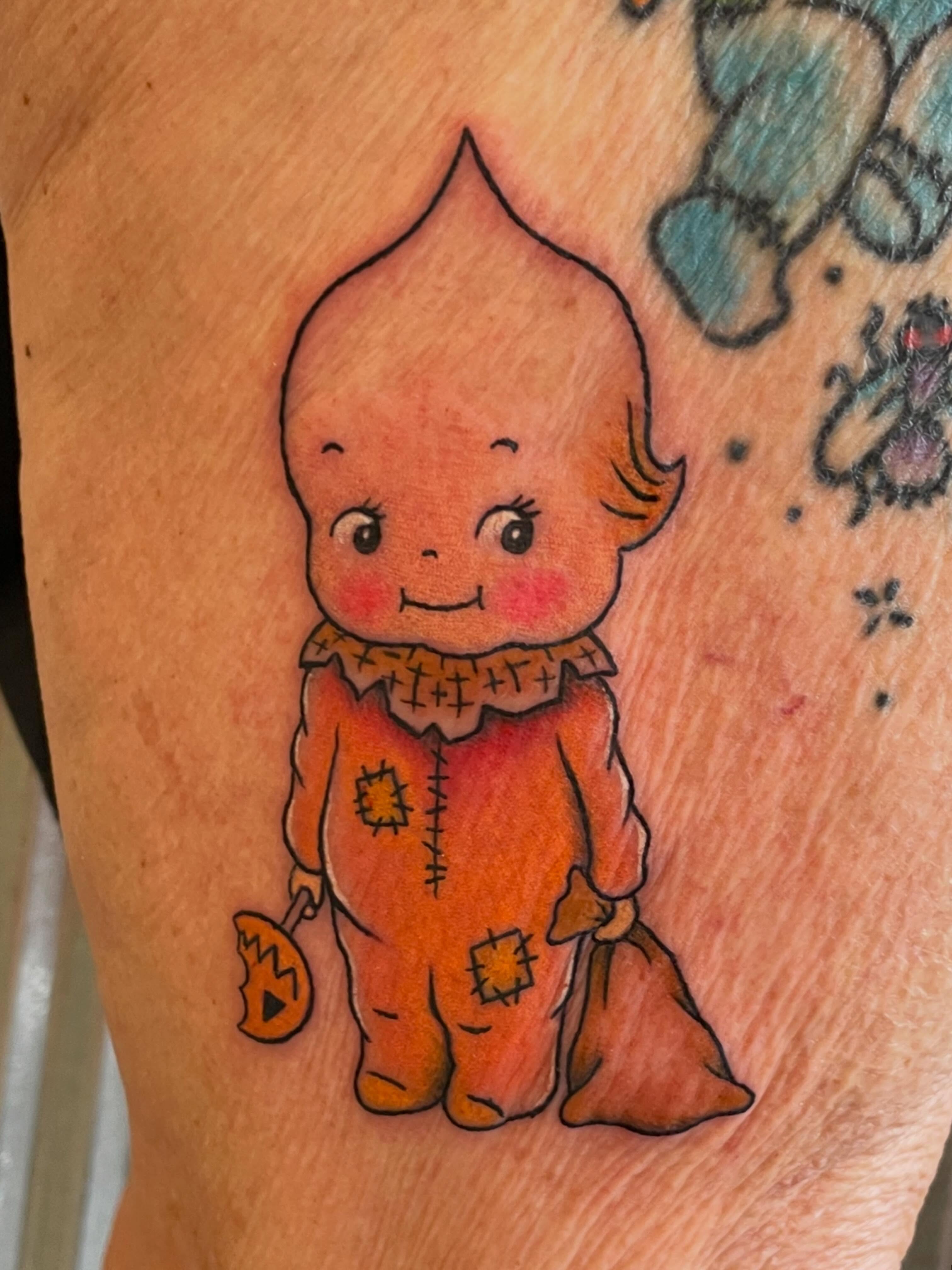 Scarecrow American traditional tattoo on the thigh by Mallory Moore