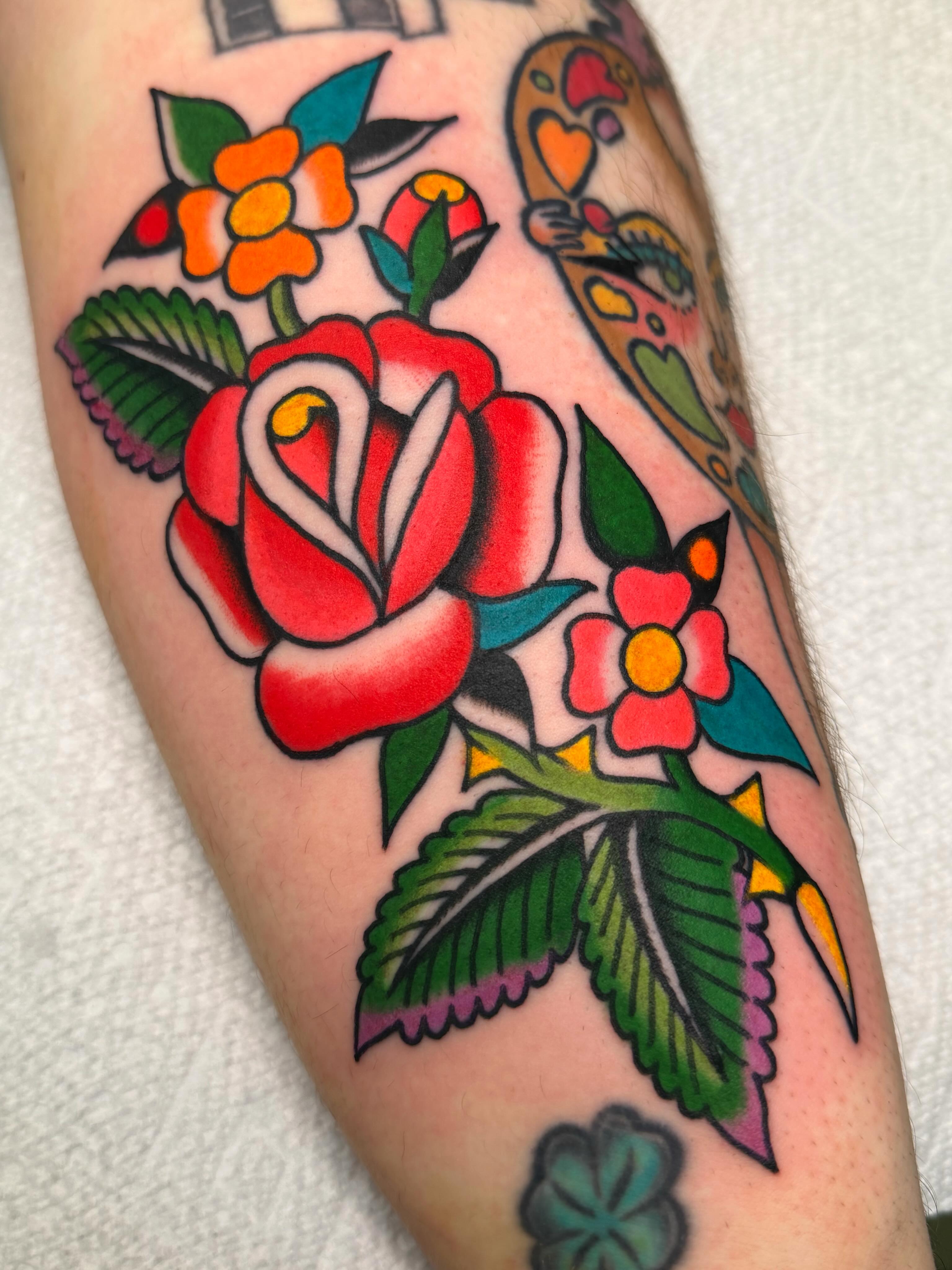 Red rose American traditional tattoo on the forearm by ⭐️ Erin Bauer ⭐️